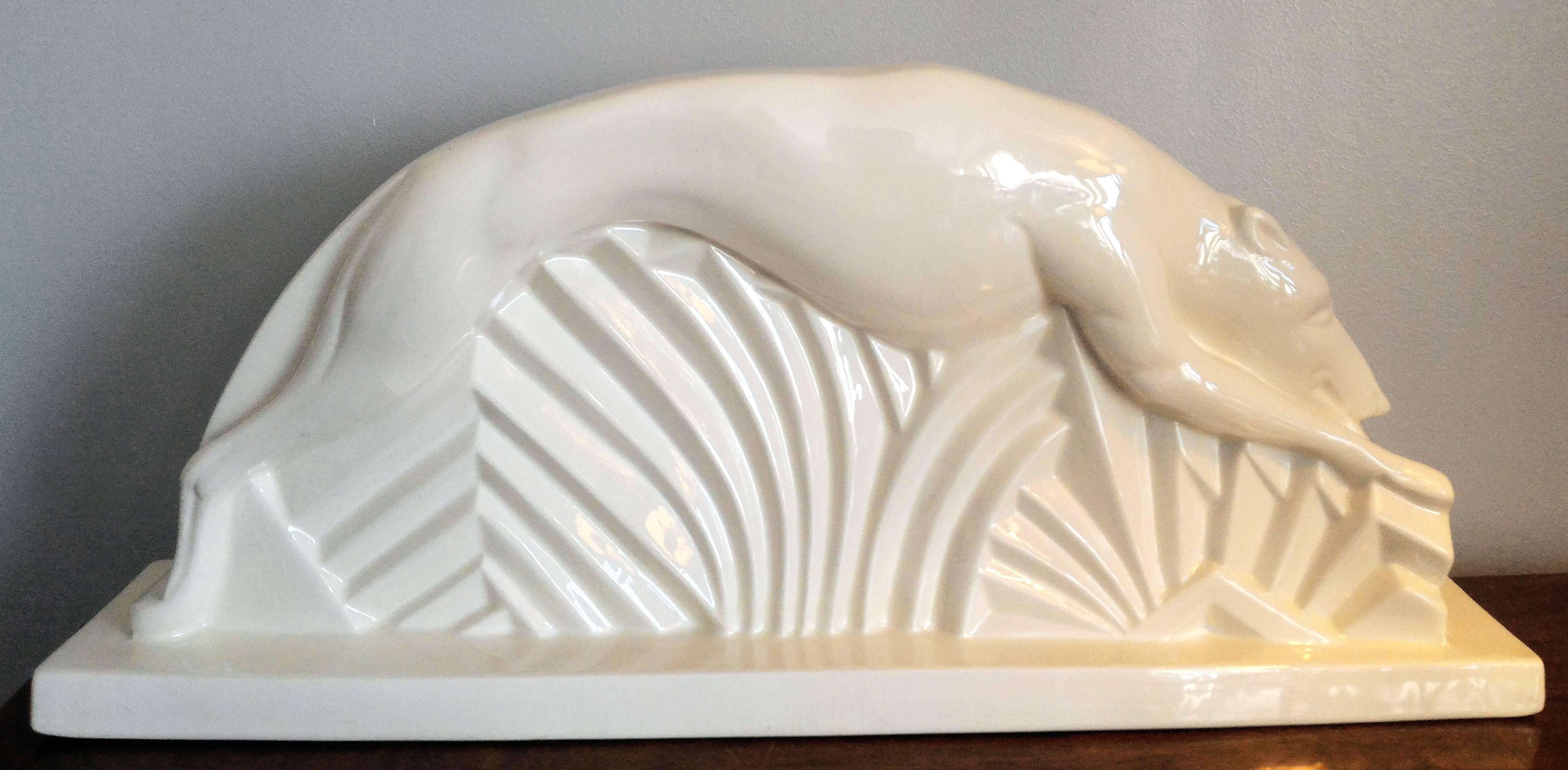 Unique and rare French Art Deco Greyhound dog, large size sculpture in ivory color, in a very good condition. Beautiful line, movements and wonderful Art Deco ornaments. 

French Art Deco, circa 1920.