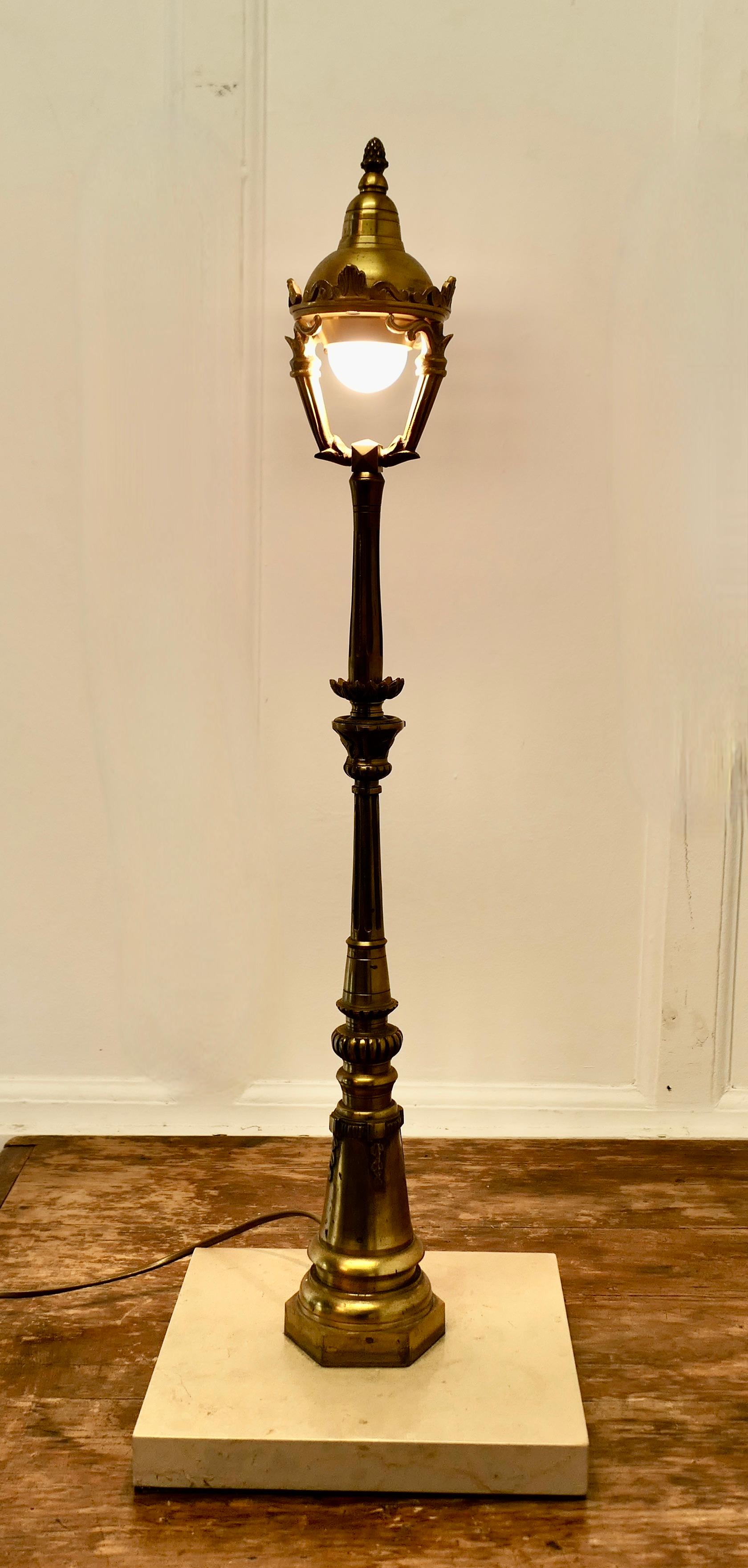 Superb French Table Lamp Modelled on a Paris Street Lamp

An Exhibition Stand Alone Piece, made in brass and set on a marble plinth
I believe this is a one off designer made piece it is in very good and working condition, it is heavy and stable,