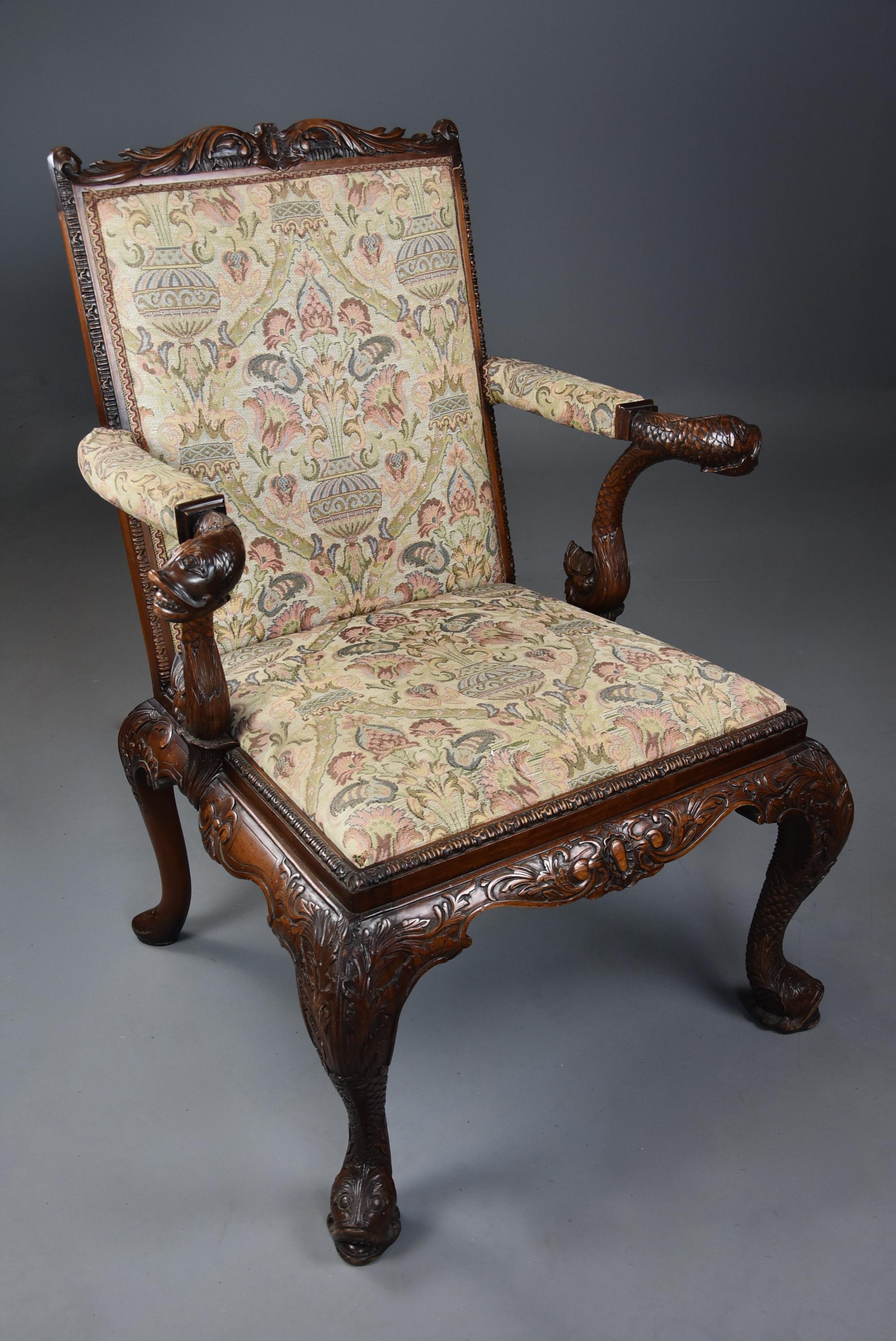 A superb quality early 20th century George II style mahogany Gainsborough open armchair or library chair of good proportions based on an original design made in the 18th century.

The chair consists of a shaped and carved top rail with a carved