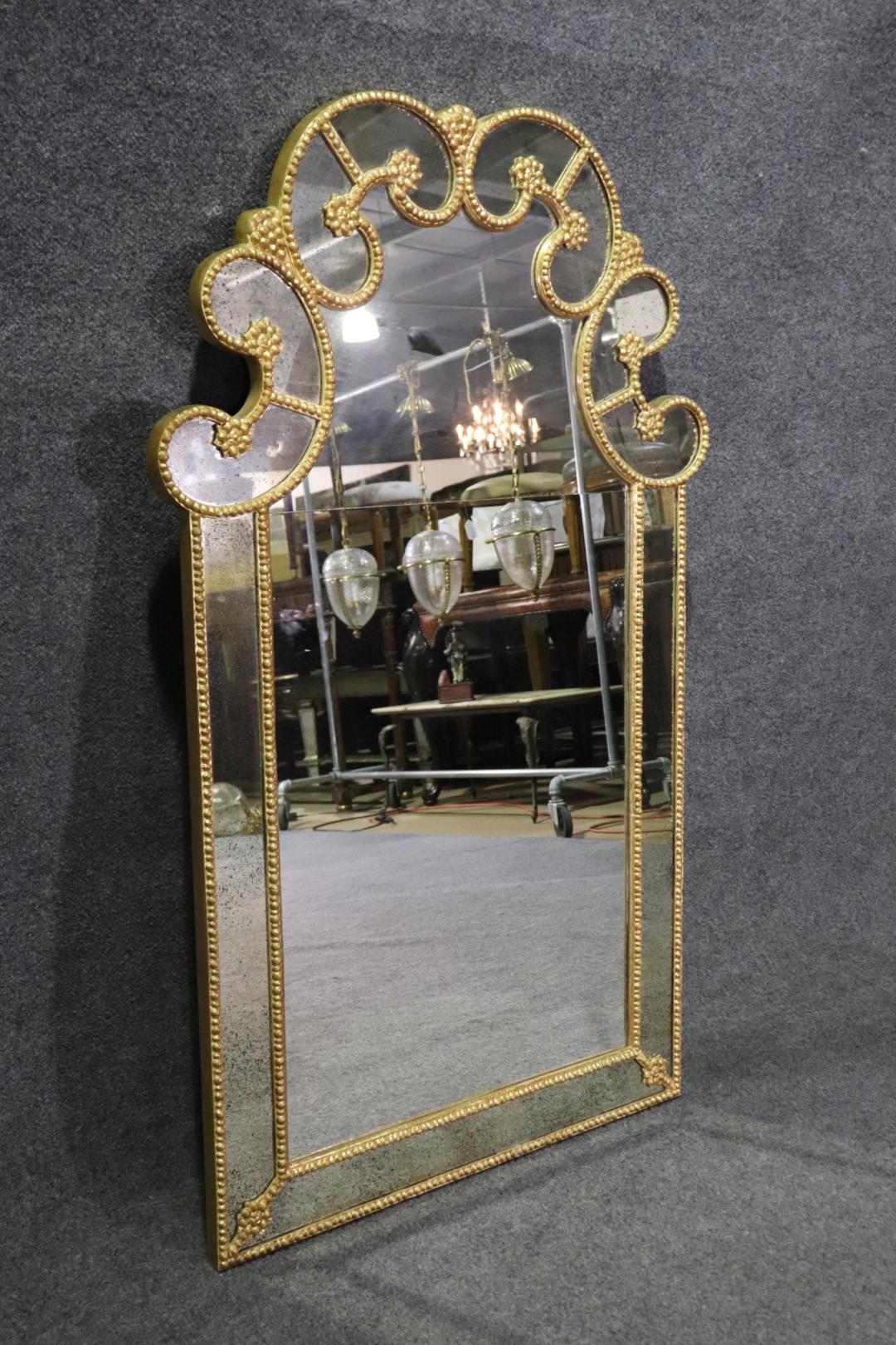 Gilt frame. Eglomised mirror on sides. 48 1/2