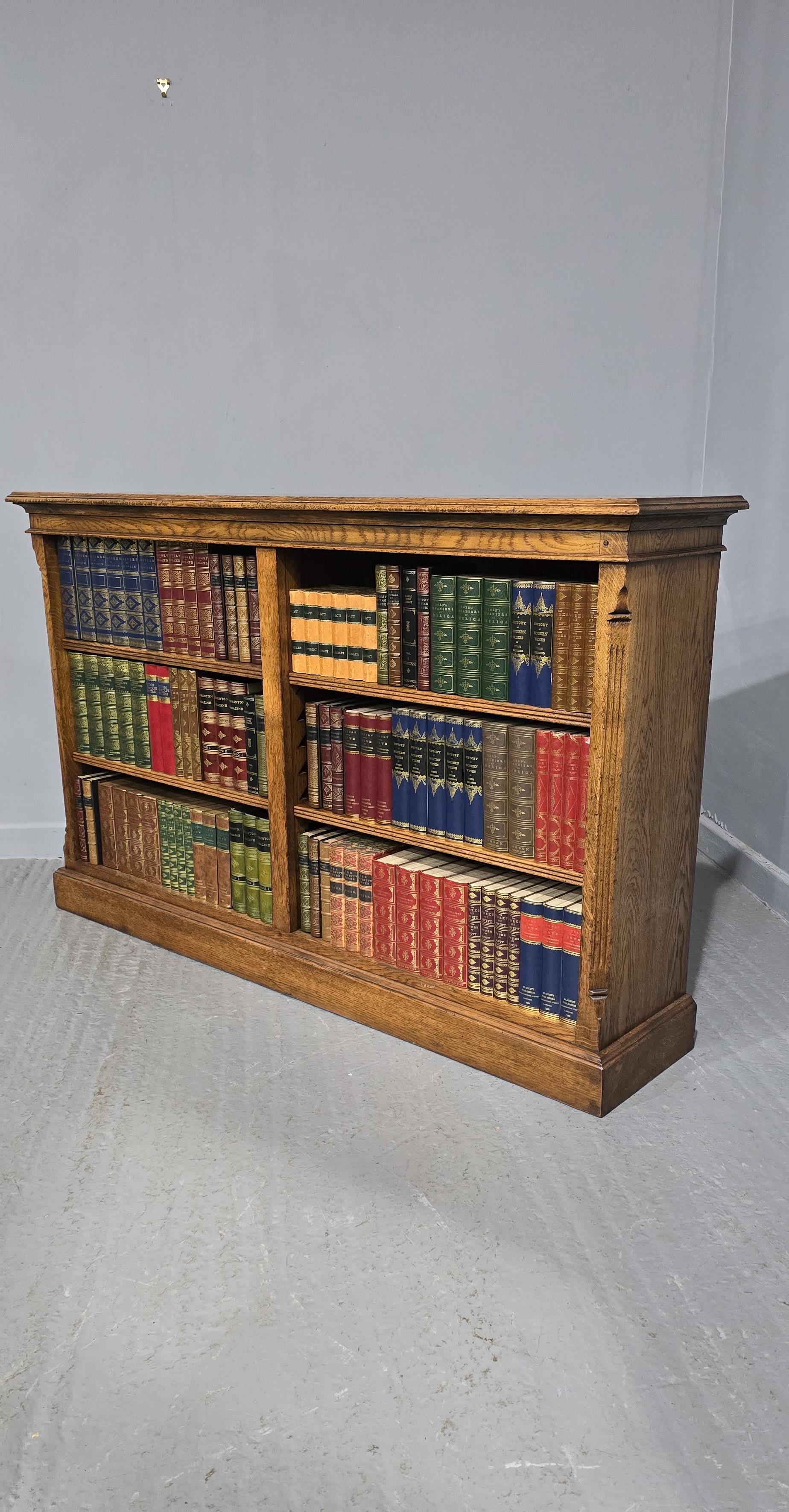 A very nice solid oak split four shelf golden oak adjustable library bookcase, peg jointed throughout, in excellent condition.

38