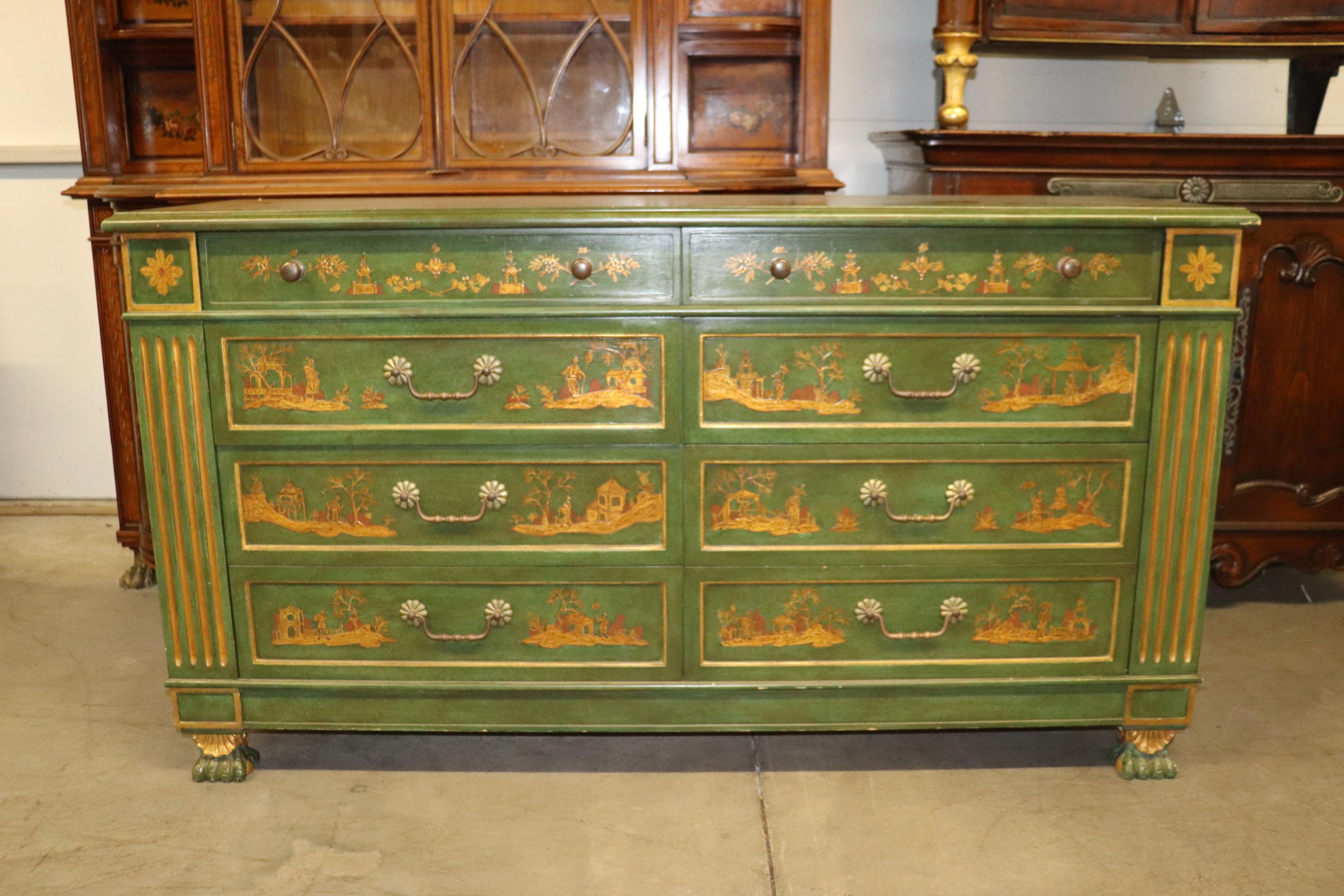 This is a truly beautiful 8 drawer French dircetoire dresser done in raised chinoiserie done in gold over a green background. The piece is absolutely beautiful and measures 67 wide x 21 deep and dates to teh 1950s era.