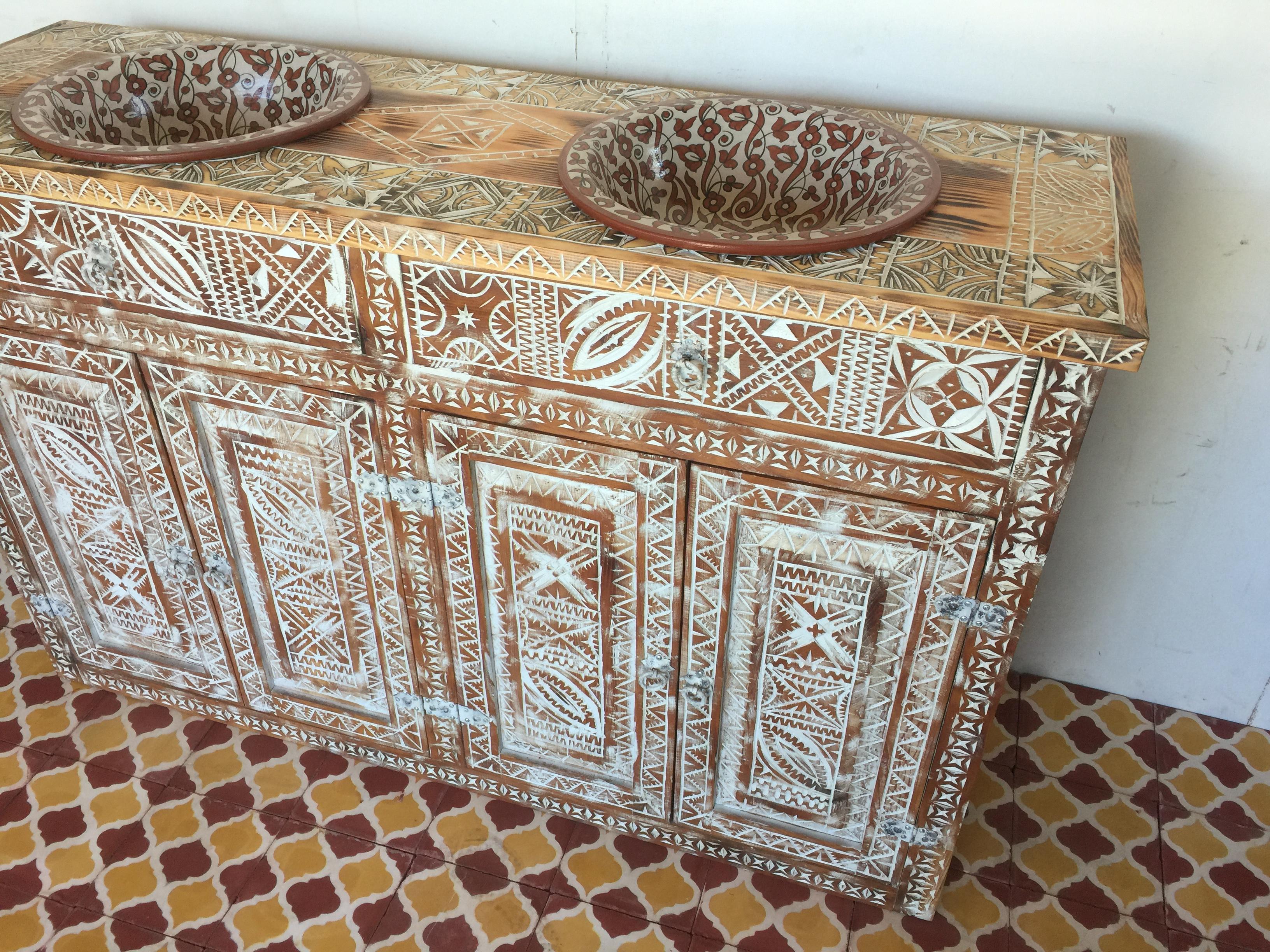 Superb hand carved and hand wash vanity with two sink made by Berber tribe in Morocco. Fantastic piece! An exotic and one of a kind?african carved cabinet vanity embellished with?african carving?work on all door panels, made of cedar, all hand