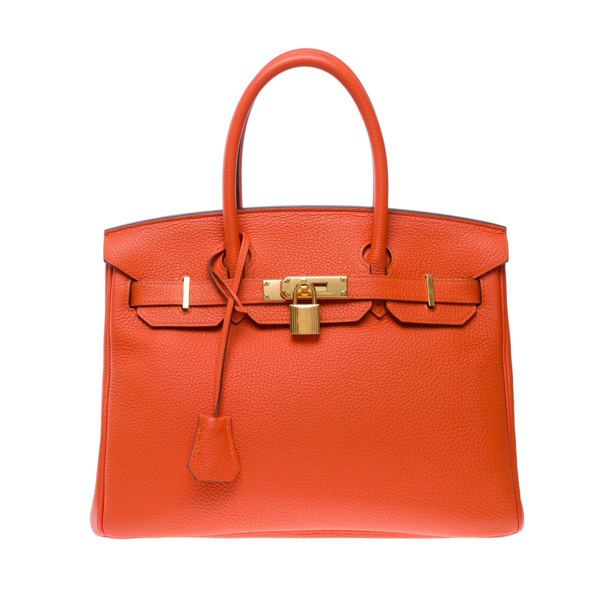 Exceptional​ ​&​ ​luminous​ ​Hermes​ ​Birkin​ ​30​ ​in​ ​Taurillon​ ​leather​ ​Clémence​ ​Orange​ ​Poppy,​ ​gold​ ​plated​ ​metal​ ​trim,​ ​double​ ​handle​ ​in​ ​orange​ ​leather​ ​allowing​ ​a​ ​hand​ ​carry

Flap​ ​closure
Orange​ ​leather​