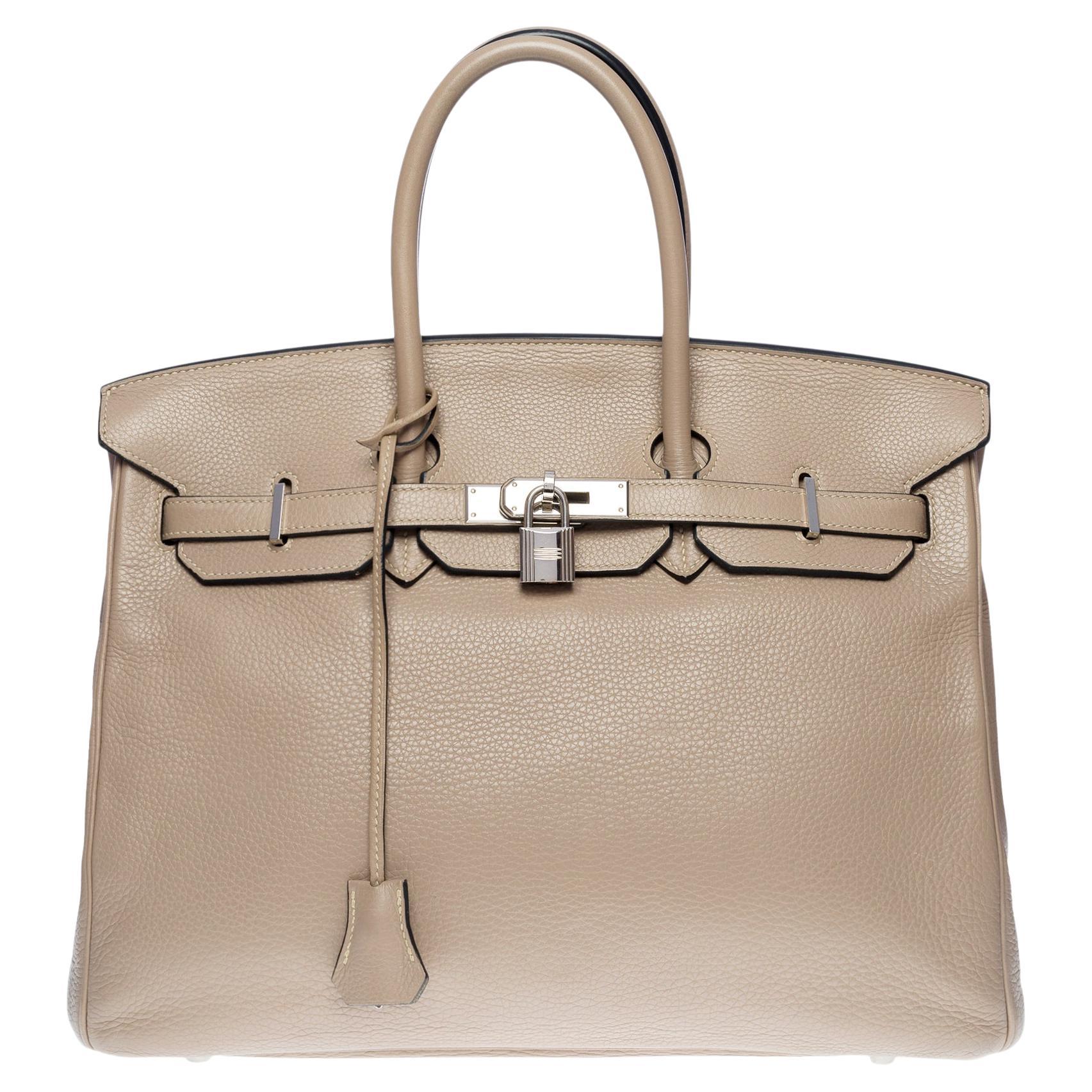 Sold at Auction: Hermes 35cm Cream Leather Kelly Retourne Bag