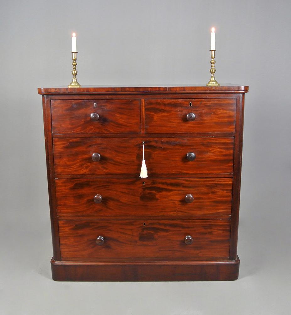 Of exemplary quality, this beautiful figured and flamed mahogany chest of drawers is by the renowned 19th century cabinet maker Holland & Sons.
  
Each drawer stamped ‘Holland & Sons’ and with original brass locks and working key.

In very well