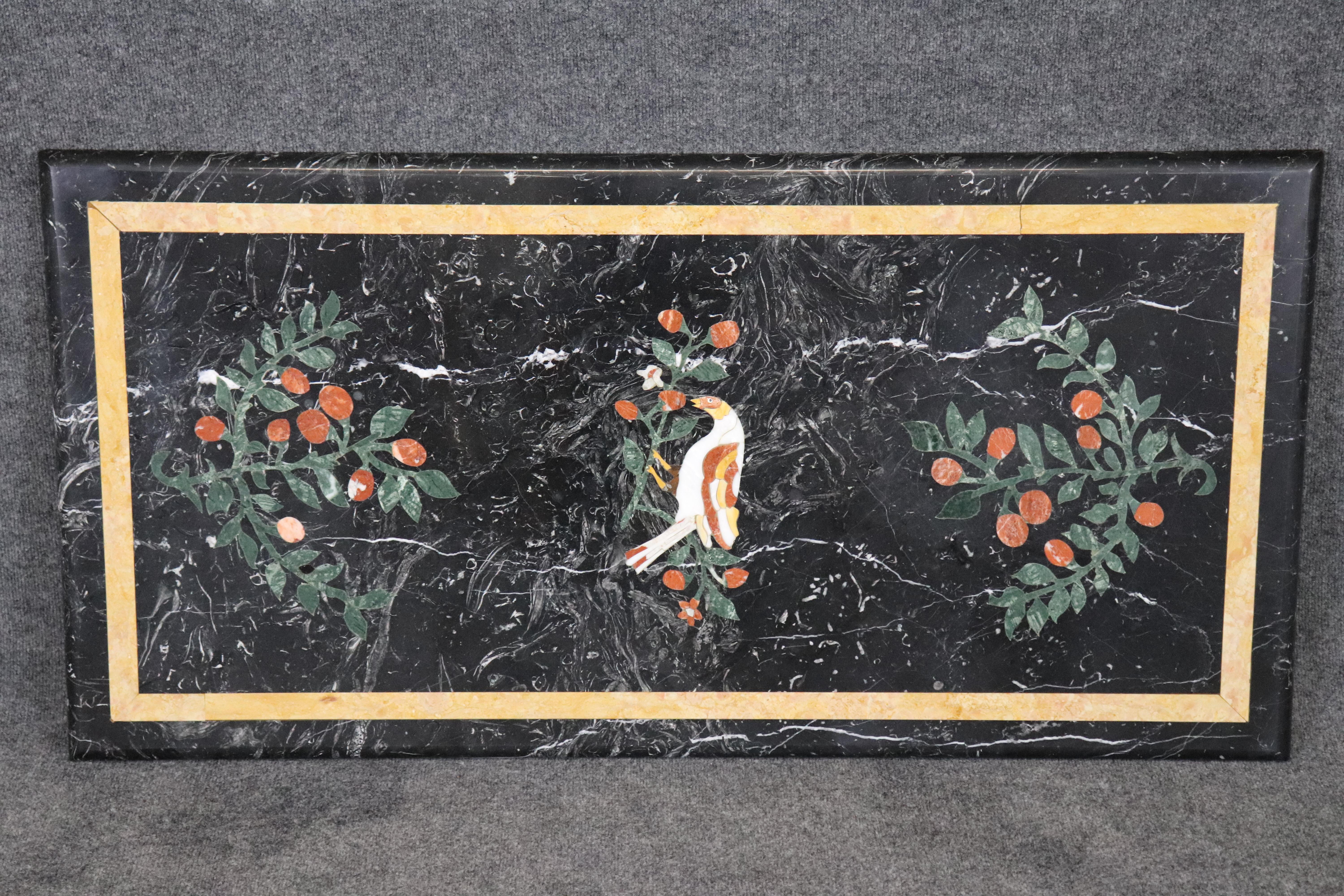 This is a table top only no base is provided.

This is a gorgeous  table top, featuring superb inlaid birds, flora and fauna and grapes and beautiful leaves. The top is perfect for any pedestal that supported a glass top and are commonly available