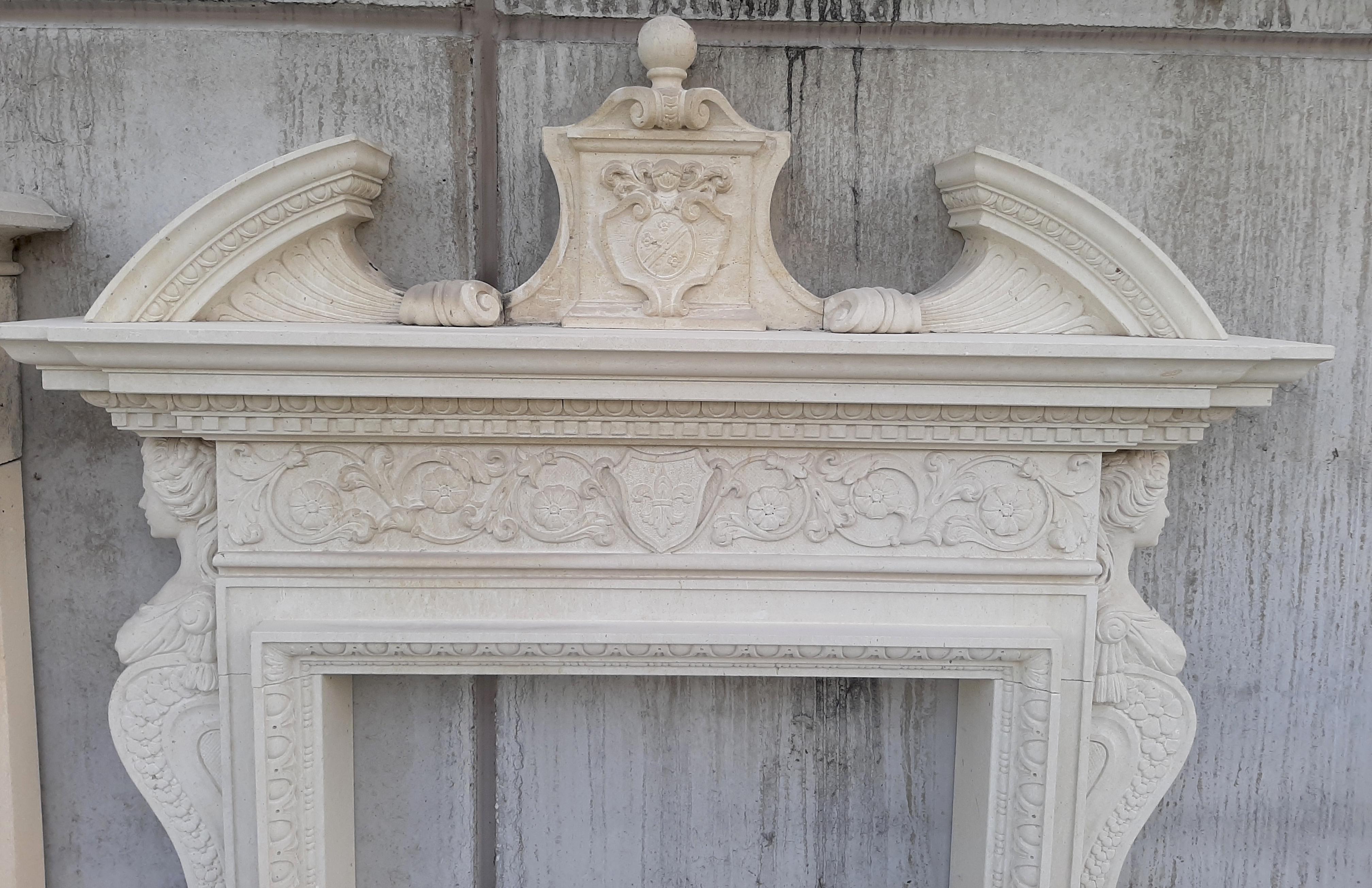 A finely carved Italian limestone fireplace with female caryatid figures and shaped frieze with elegant acanthus leaves decoration.

 