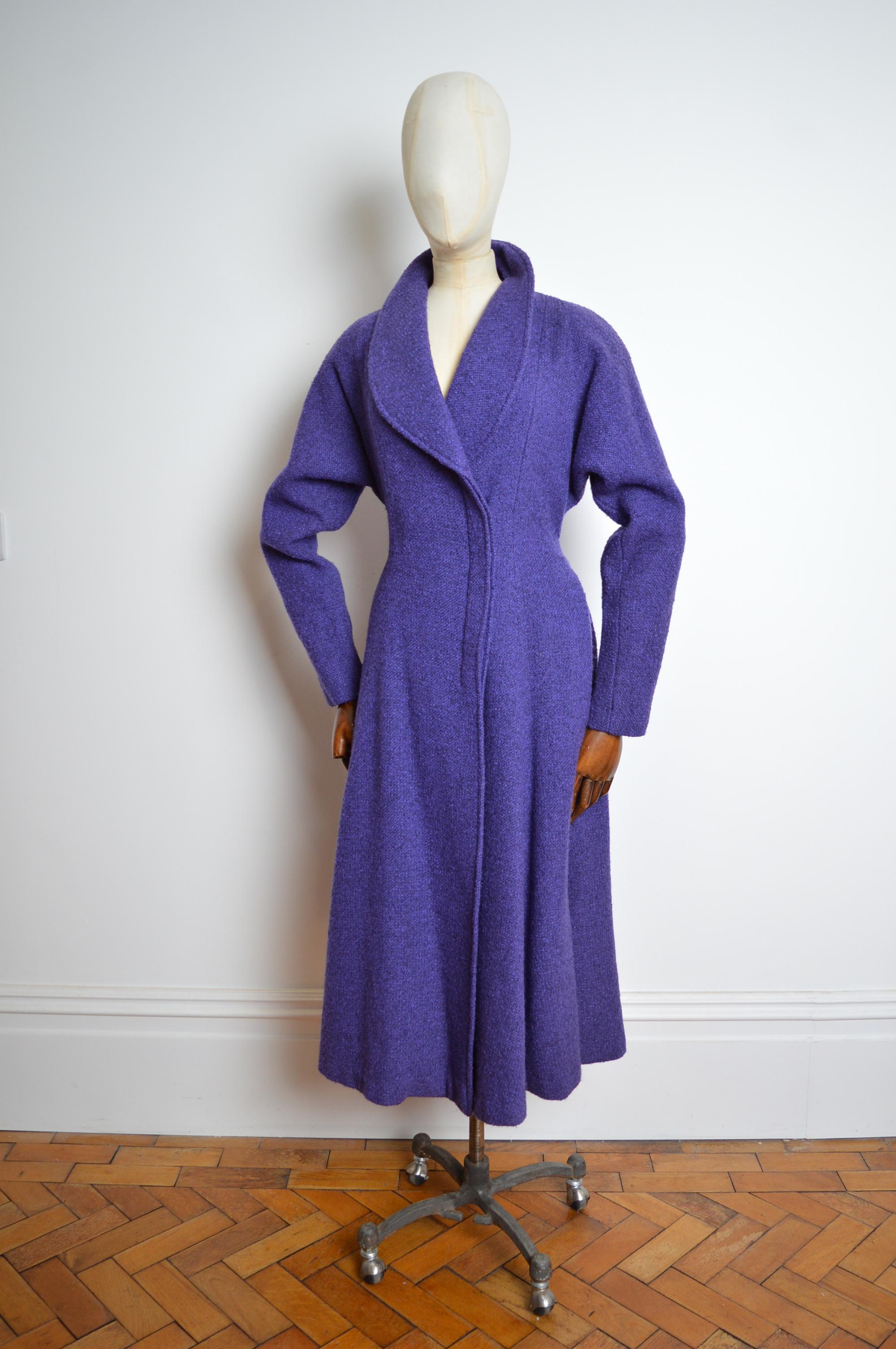 Superb Jeanne Lanvin 1930’s long Purple Tweed Wool Swing Coat 
MADE IN FRANCE. 
Remarkable 1930’s Jeanne Lanvin Coat in Purple Tweed, superbly cut along the waistline with asymmetric celluloid Buttons down one side, Padded Shoulders, a chic rounded