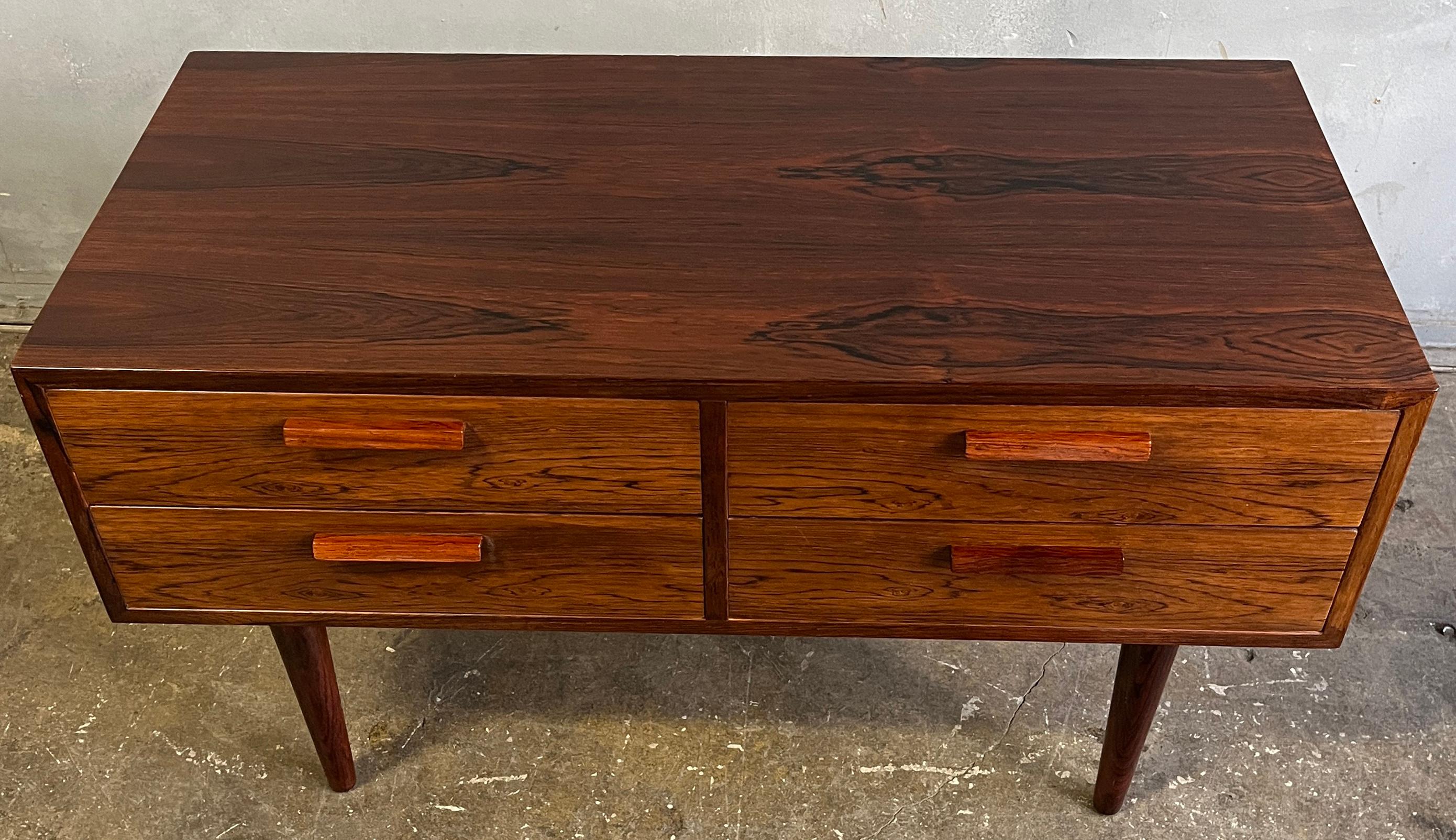 Beautiful and seemly never used chest of drawers by the famous designer Kai Kristiansen, Denmark. Model # 701
Featuring four very clean drawers framed in amazing rosewood. In wonderful condition and ready for use.

Local pickup always free.