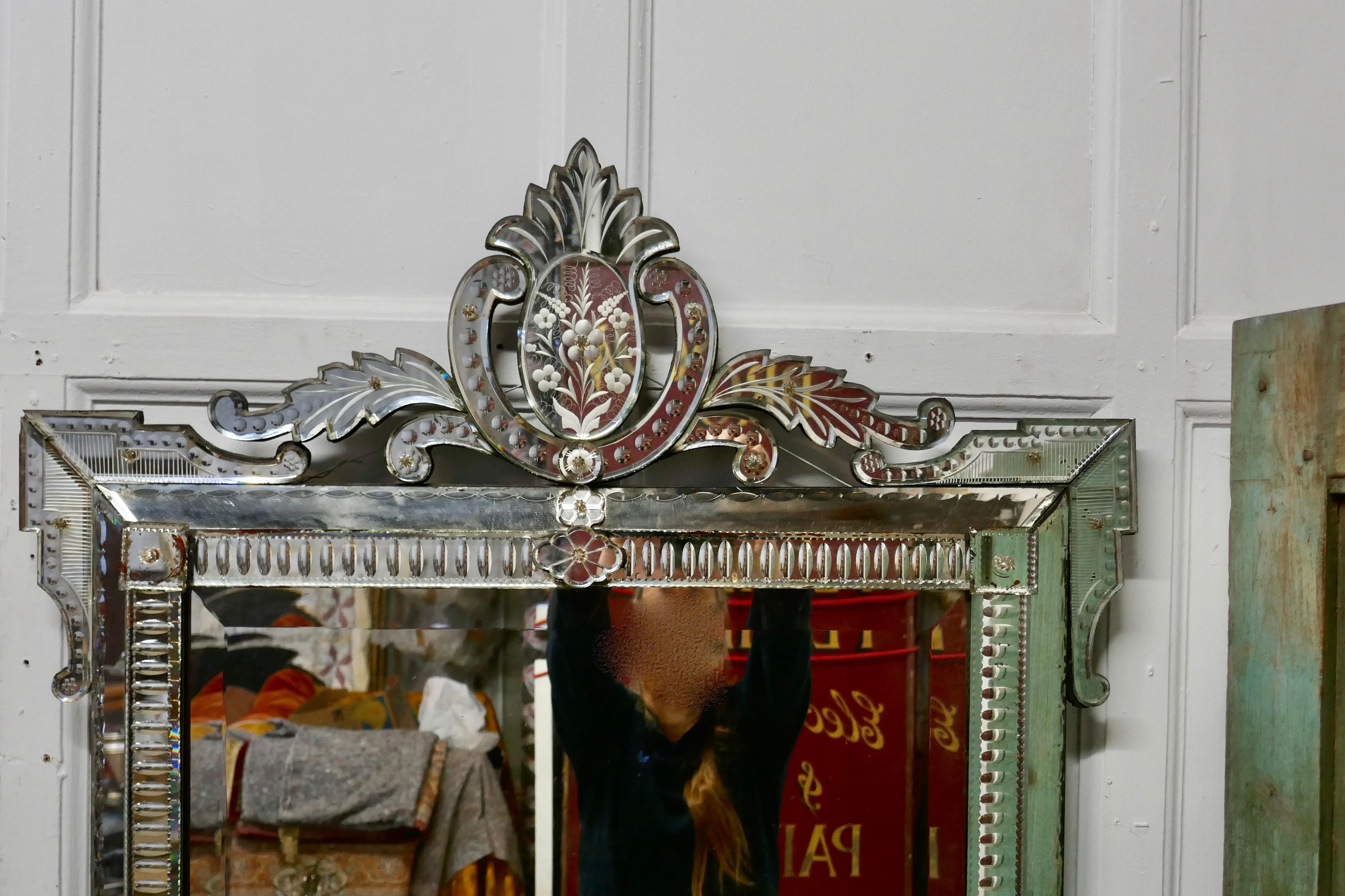Superb large 19th century venetian cushion mirror

This is the most outstanding piece, it is absolutely original, it has a rectangular shape and a floral theme to the decoration with an elegant leafy cornice and angular detail to the