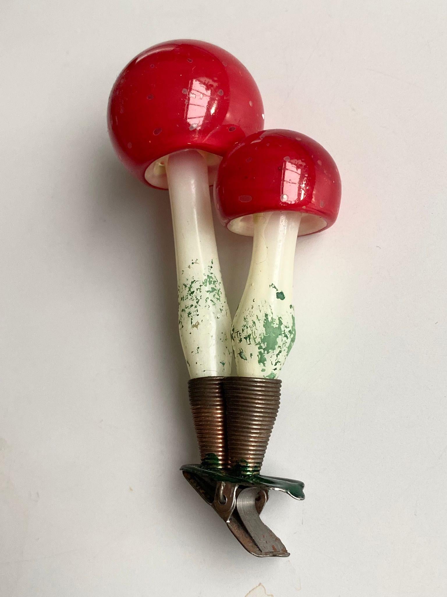Rare large vintage glass clip-on mushroom family, Christmas ornament, ca. 1960's.
Beautifully decorated; the bright dots of the small shades will light up througout Christmas lighting hanging in the tree. The piece remains in good condition with