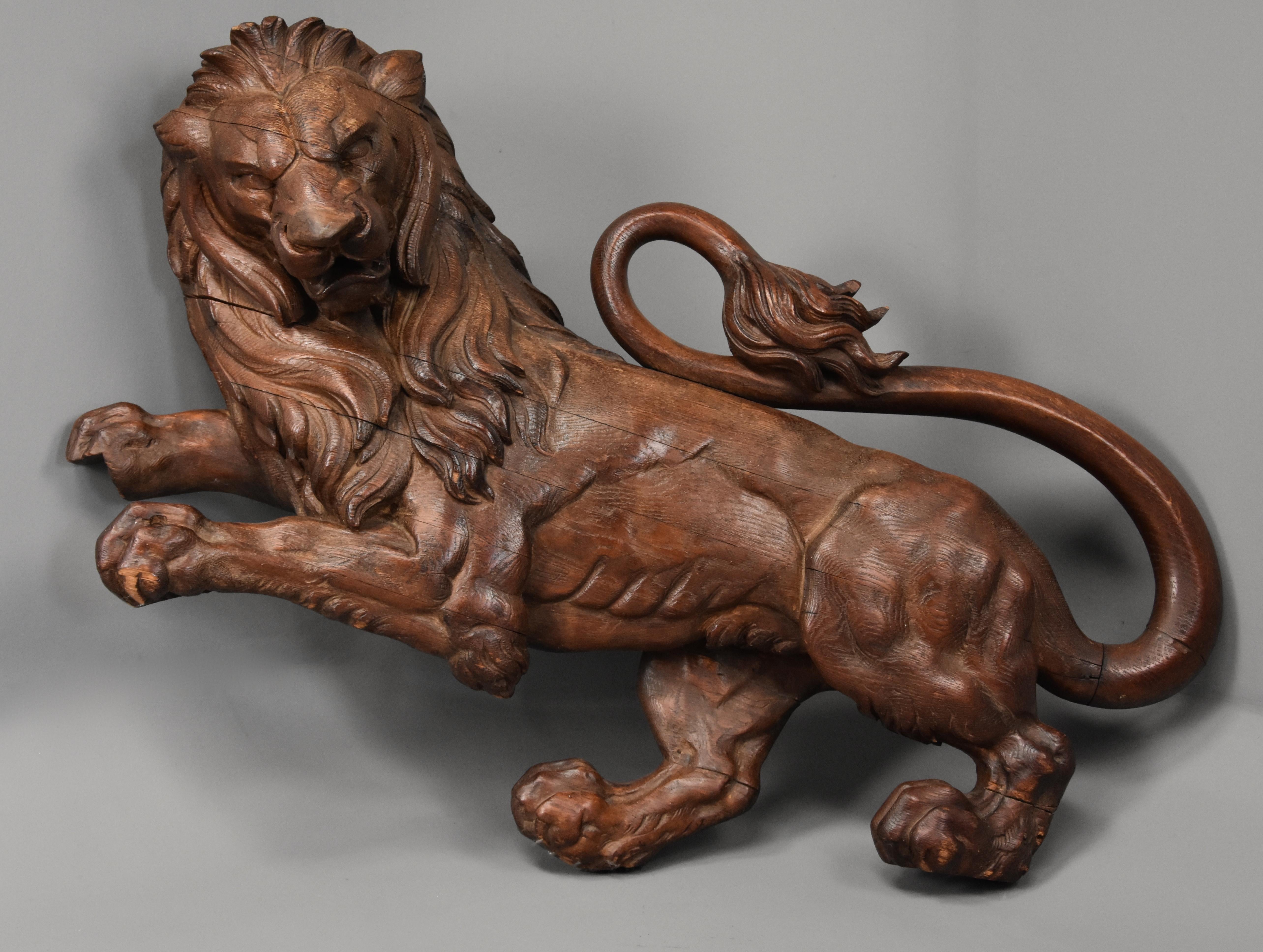 A superb large late 19th century, circa 1880 highly decorative carved oak rampant lion.

This carved lion was possibly originally part of a large coat of arms or armorial, the lion consists of a finely carved face, mane and tail standing on his