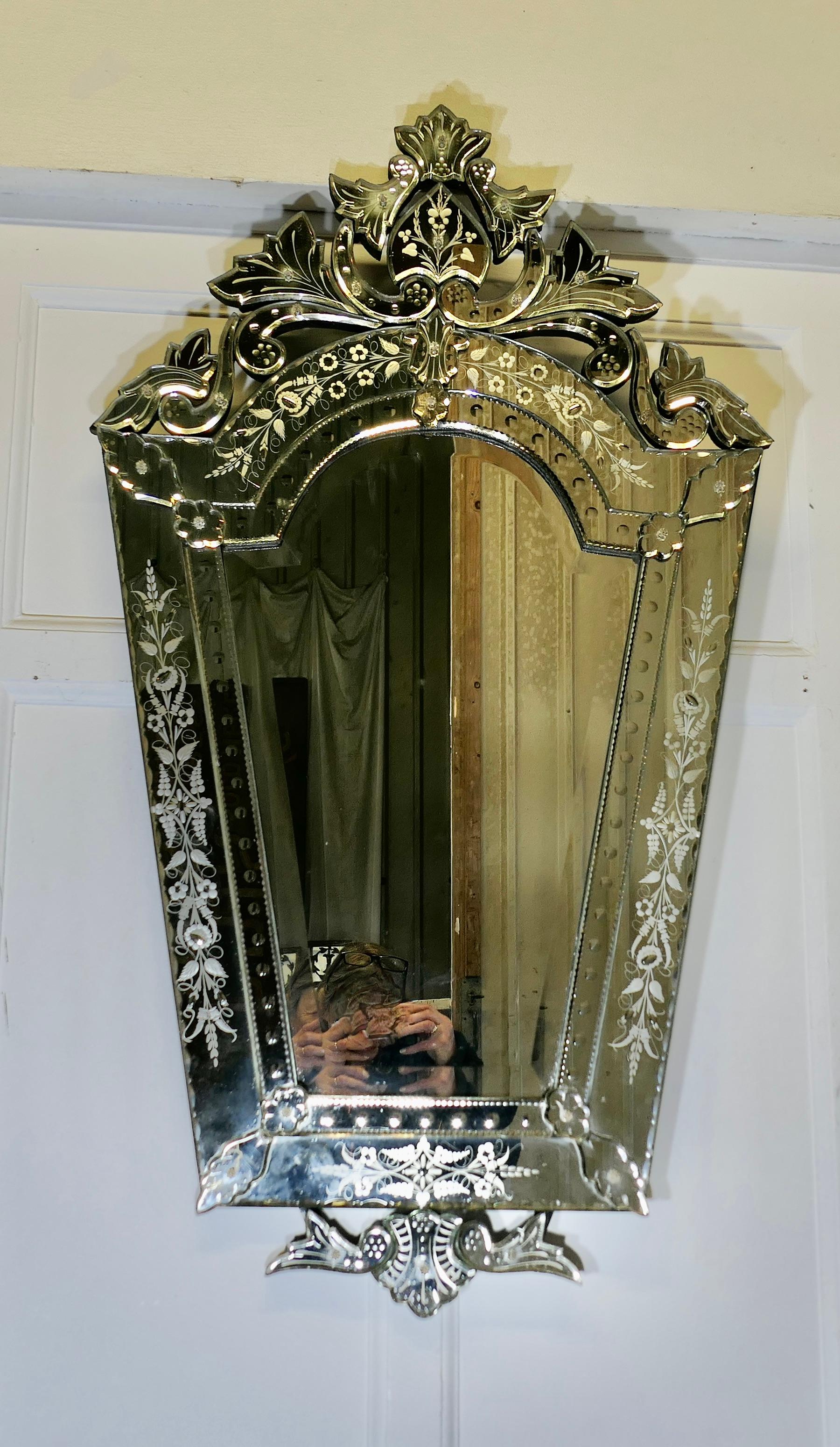 Superb Large Venetian Cushion Mirror

The mirror has an unusual shape and a floral theme which is carried throughout on the etching on the Mirror Surround
The Mirror has an elegant leafy cornice and a bevelled glass in the centre 

This is the most
