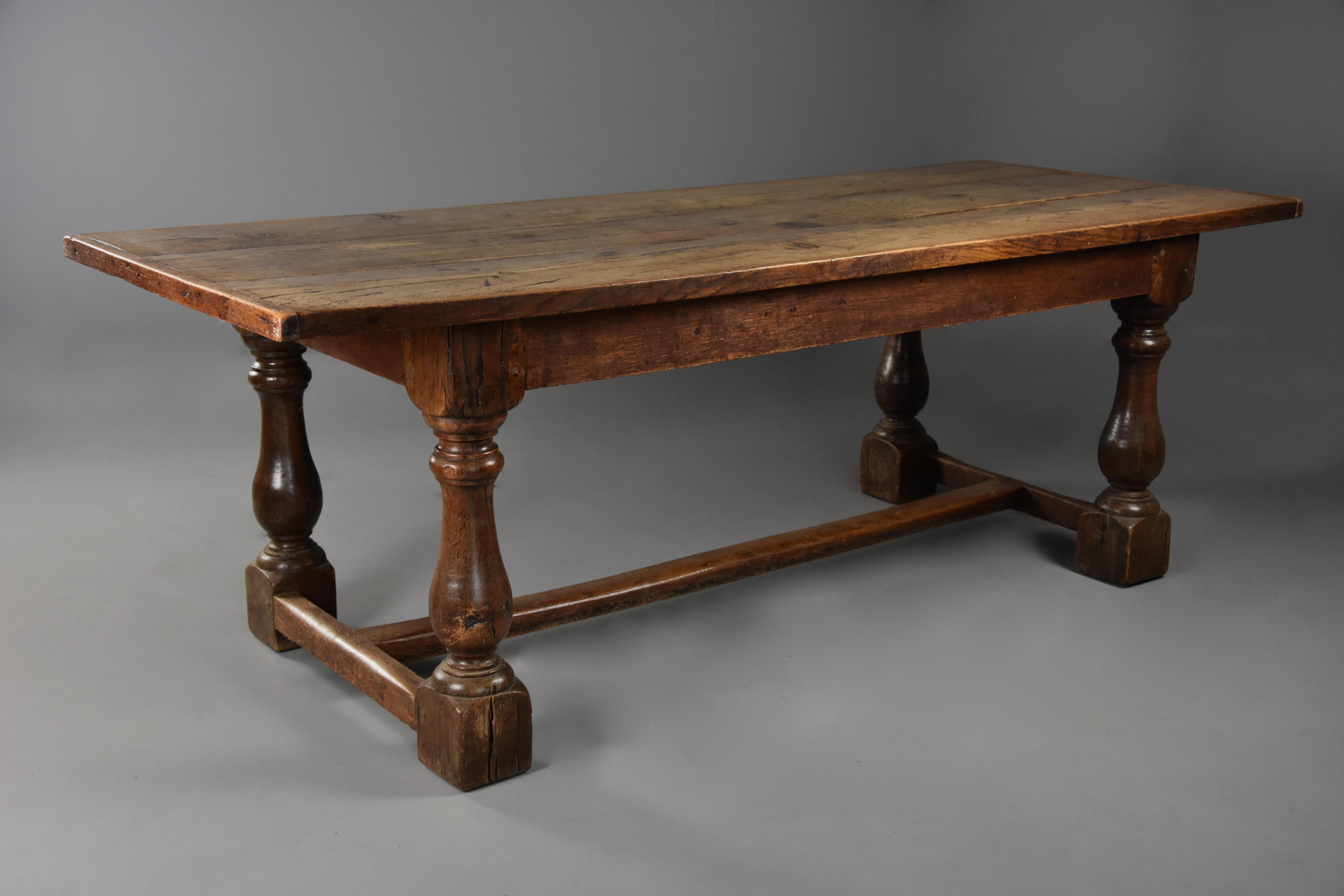 A superb late 19th century Arts & Crafts oak refectory table with fine faded patina (color).

This table consists of a three plank solid oak removable top of superb faded patina with cleated ends.

This leads down to the base which consists of