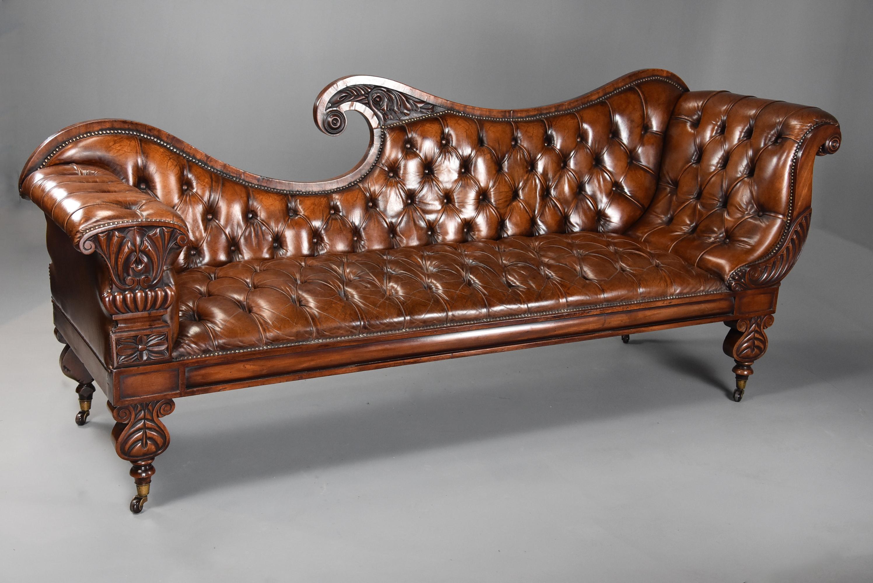 A superb late Regency/William IV (circa 1830) mahogany scroll back deep buttoned brown leather sofa with design influences of the notable 19th century Furniture designers John Taylor and George Smith.

This sofa consists of a shaped mahogany back