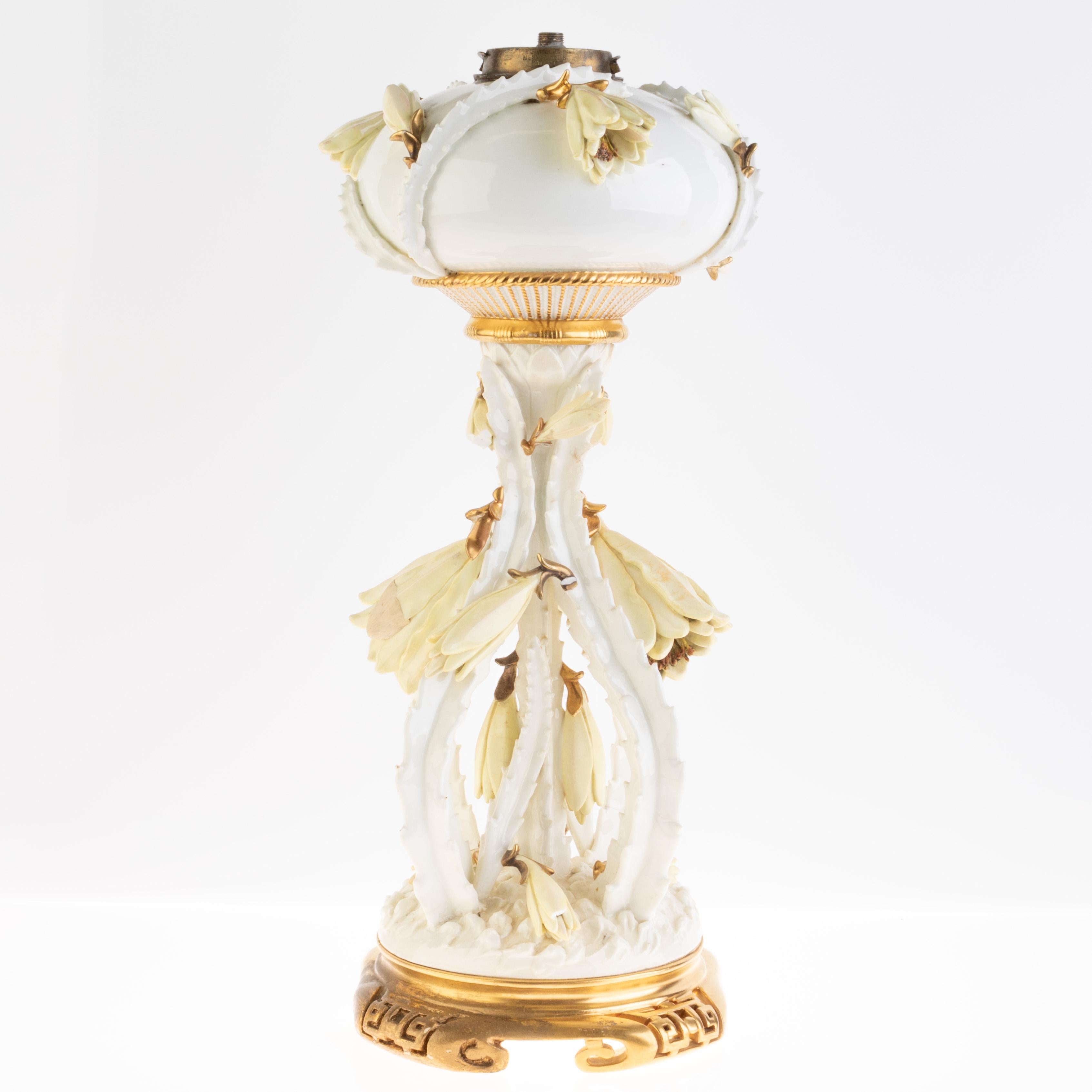 Superb Late Victorian Early Art Nouveau Moore Brothers Gilt Porcelain Oil Lamp 

Moore Brothers Porcelain refers to a line of fine porcelain that was produced by the Moore Brothers company, an American ceramic manufacturer active primarily in the