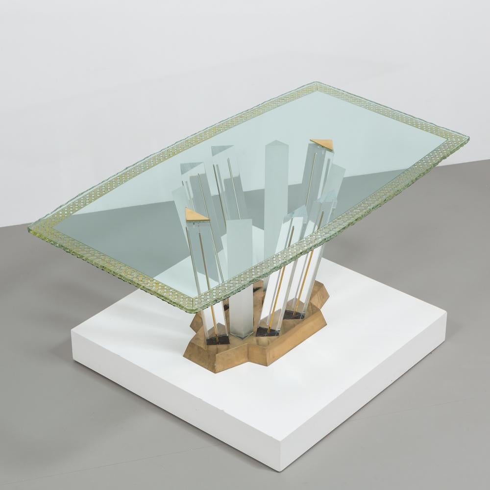A superb Lucite and bronze dining table with unique glass top, 1970s. 

This extraordinary sculptural dining or centre table is made from the highest quality clear and opaque Lucite set into a cast bronze base. The beauty of the Lucite is further
