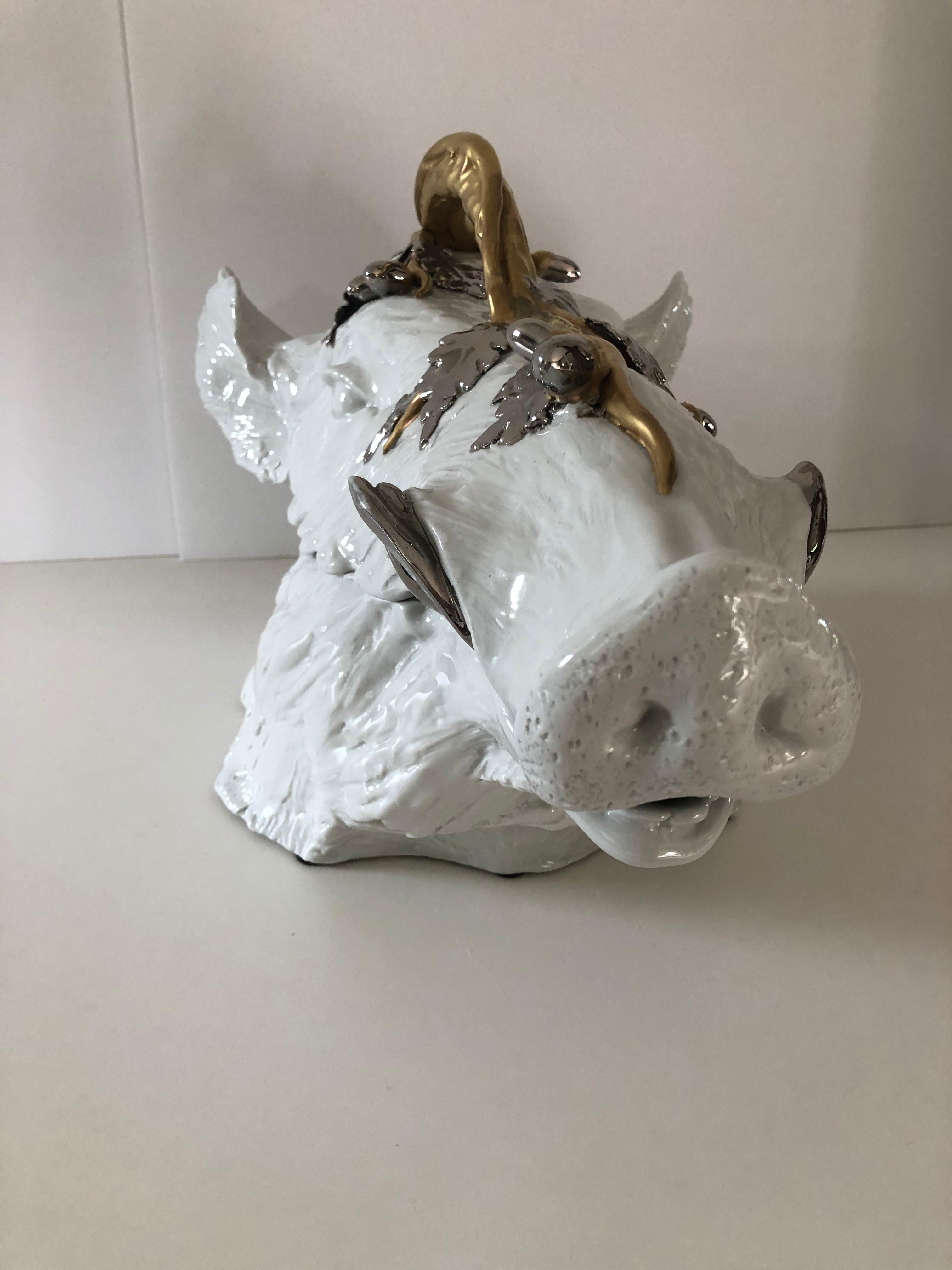 A superb porcelain wild boar tureen designed by Florentine ceramist Giulia Magnani. Magnani is internationally recognized for the exceptional quality of their pieces and exquisite designs. This stunning piece is white porcelain with a bold use of