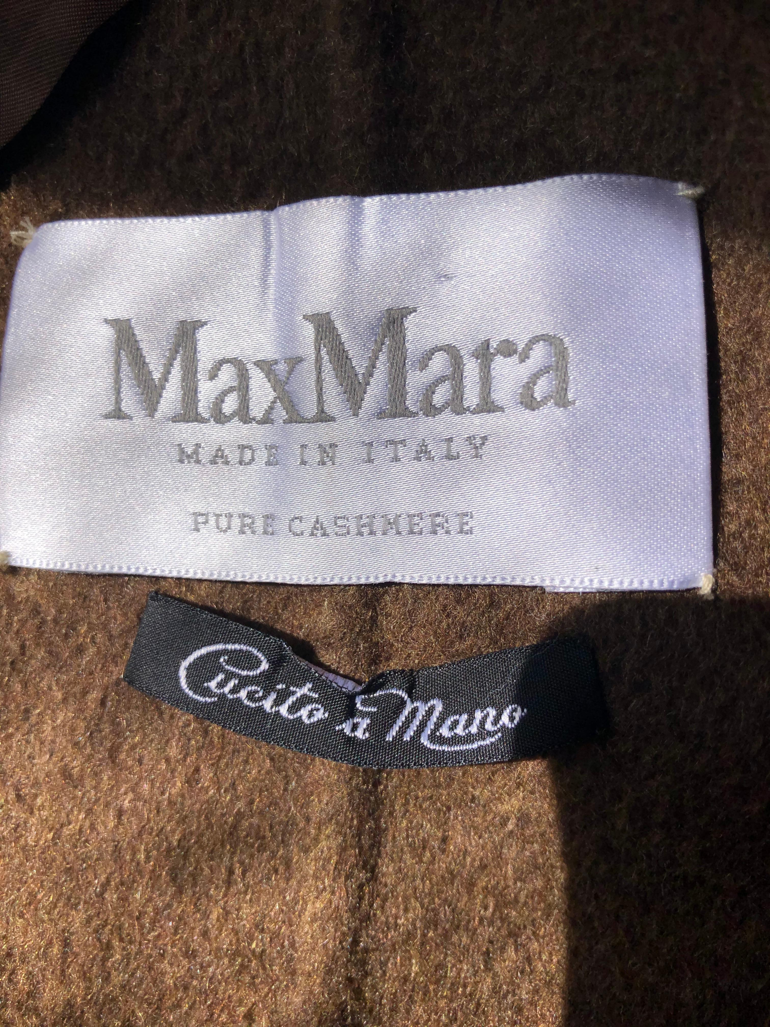 Max Mara quality at its best ! This 100% cashmere coat is hand made with stitching around the pockets and collar. It is in immaculate condition and has never been worn. The label says size 4 but it wears bigger as it is a 40 bust and 39