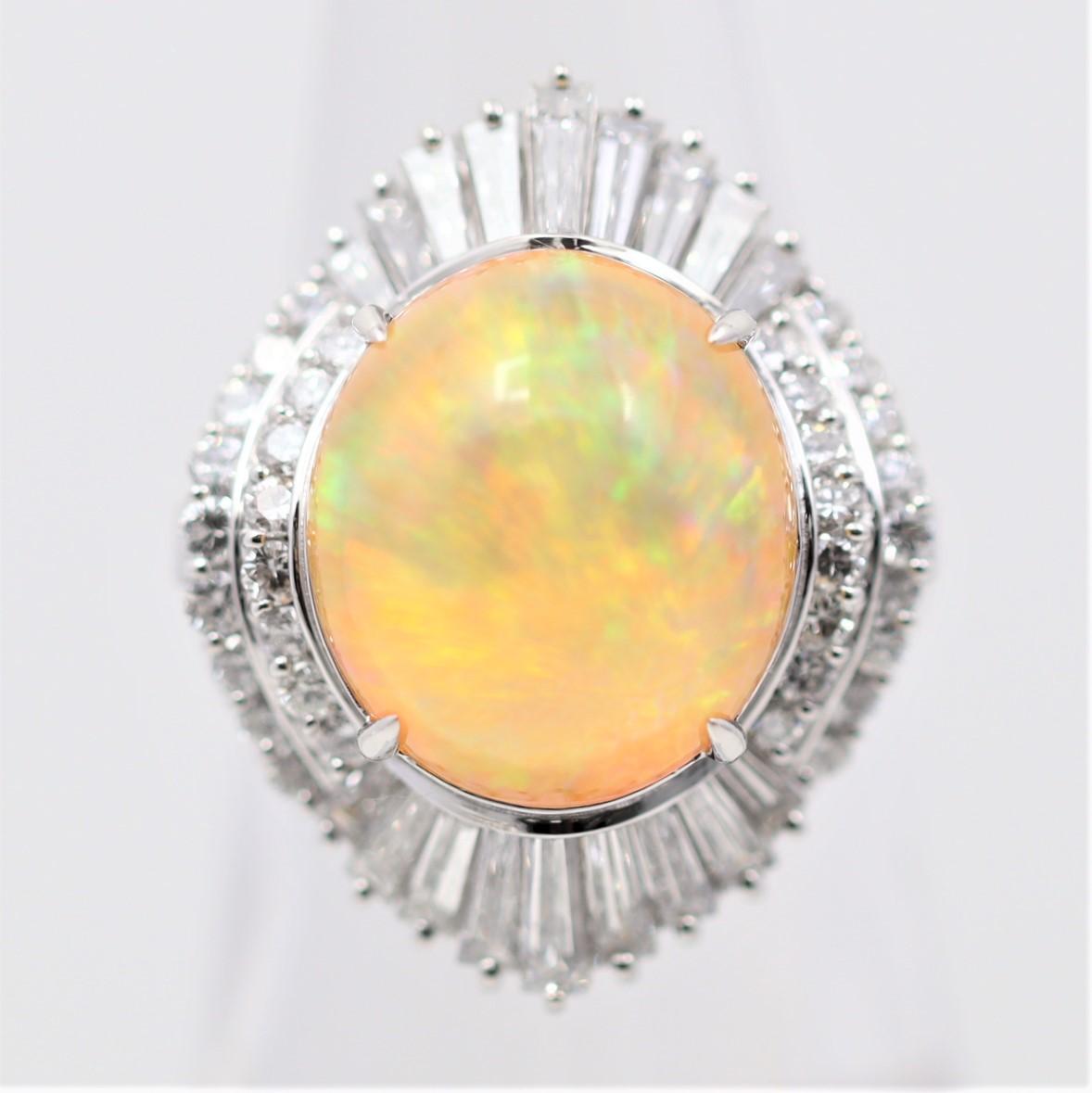Calling all opal lovers!! We have a very special piece here with a 7.70 carat Mexican fire opal. It has absurd play-of-color, might be the finest I’ve seen in a fire opal, as an array of greens, blues, oranges, and reds radiate from the stone. It