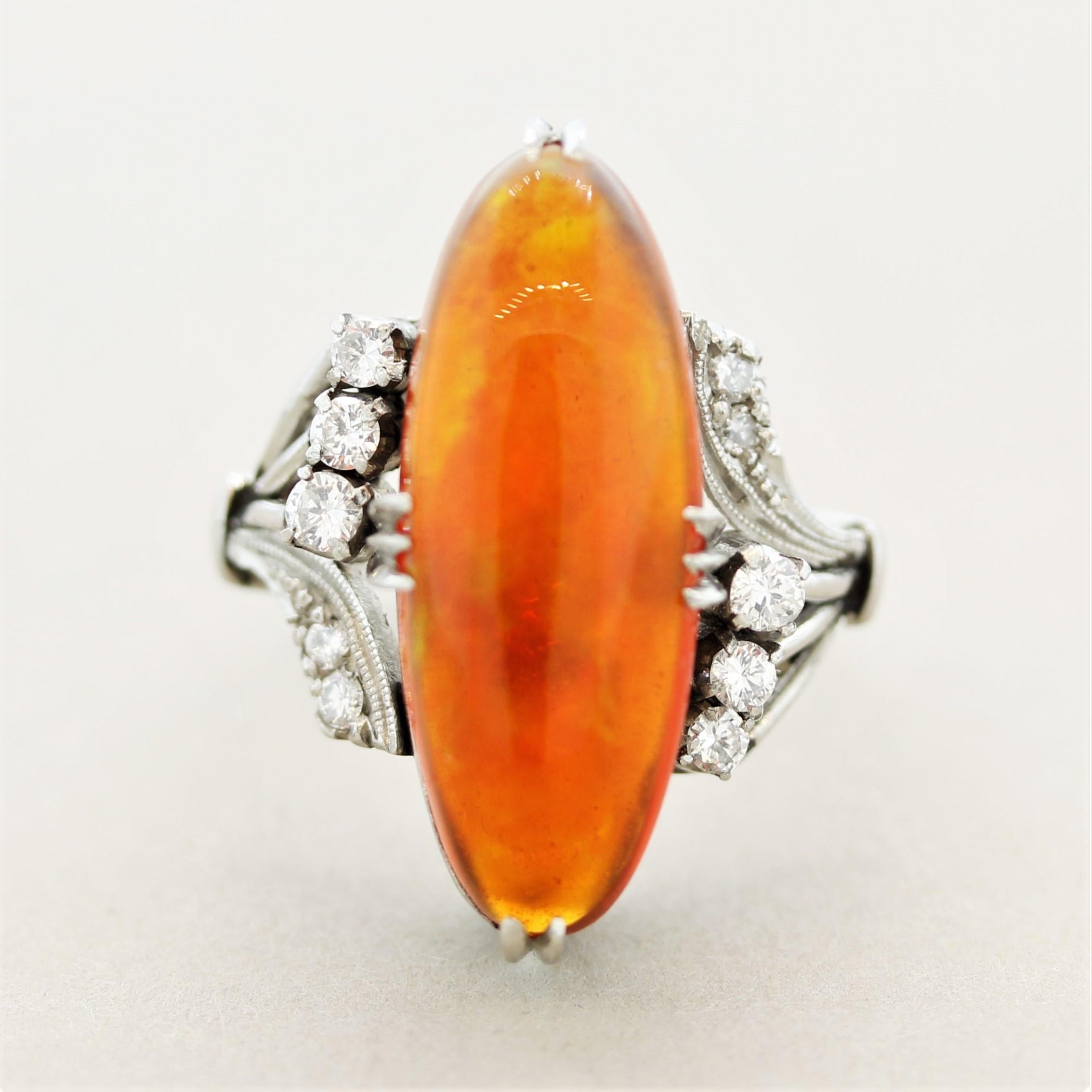 Simply stunning! This natural fire opal has a rich intense orangy-red body color with excellent play-of-color which is rare in fire opals. Bright and prominent flashes of red, orange, and yellow dance across the stone as it moves in the light. It is