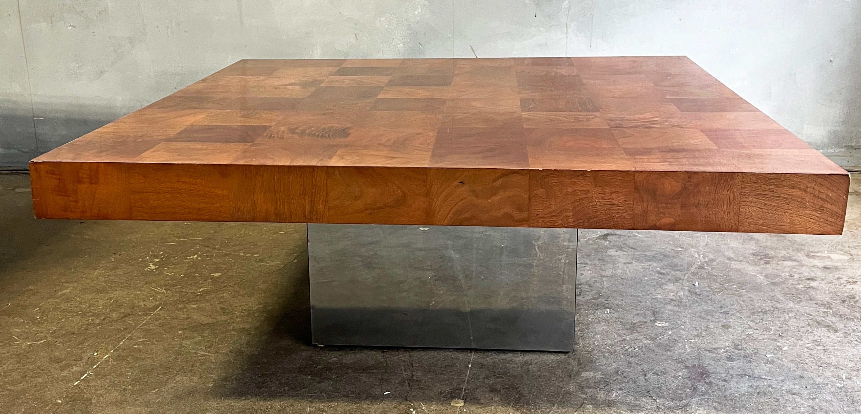 Large and beautiful 40'' olive wood and chromed base coffee table by Milo Baughman. Inlay burl wood / patchwork wood top.
Labeled- Thayer Coggin by Milo Baughman on the underside. Gloss finish

Made in the 60's with the same style as Paul Evans