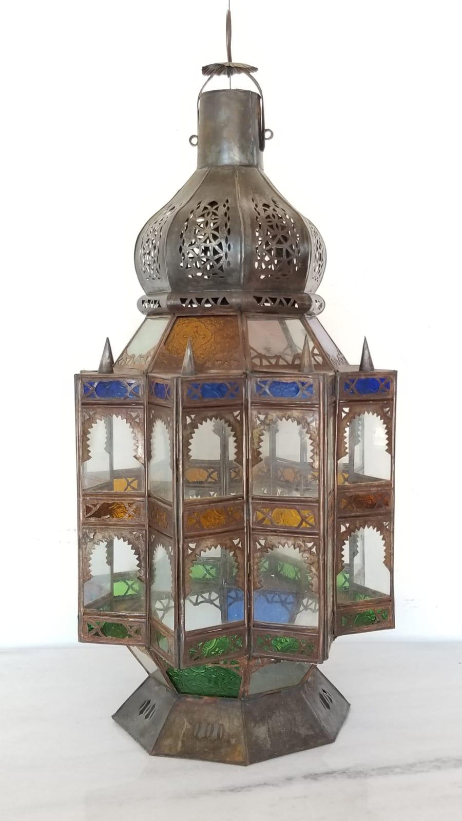 Superb Moroccan rustic lantern chandelier with bottom and can be electrified great workmanship, all handmade. A great piece for indoor or outdoor. The lantern come with frosted glass and multi-color Moorish glass amber, blue and green.