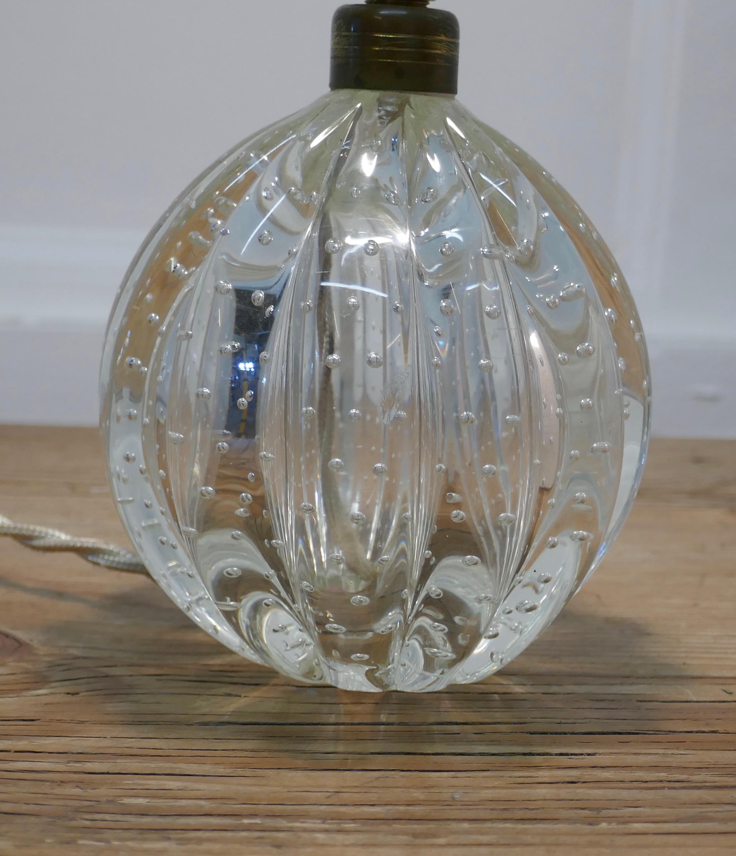 Superb Murano clear glass lamp, with controlled bubbles

A lovely piece of Murano, the original Murano label is very worn but still visible, the lamp has a delightful shape like a Cantaloupe Mellon with controlled bubble decoration
The lamp is