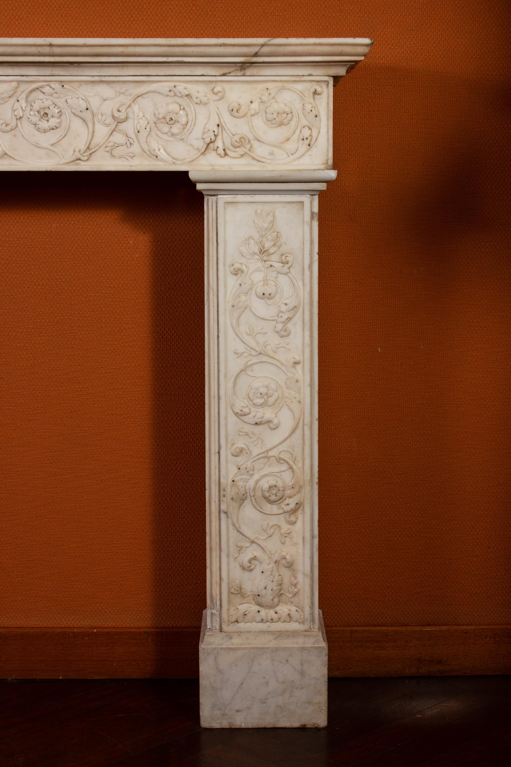 A finely carved Italian Carrara white marble fireplace with shaped frieze, centered with griffons and elegant acanthus leaves decoration.
Provenance from a Roman Aristocratic Palace.
 