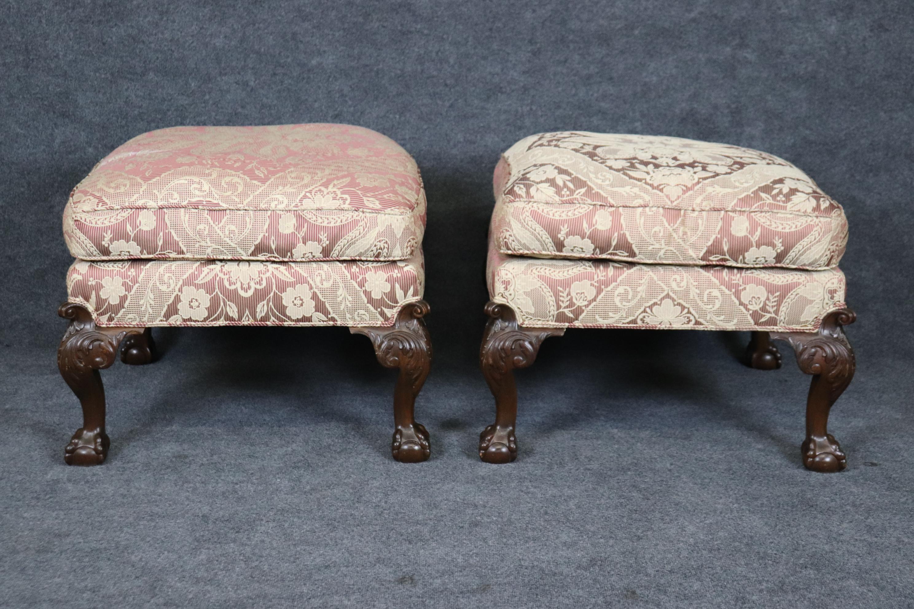 These gorgeous stools are absolutely gorgeous and feature incredible carved ball and claw feet and acanthus leaves on the leaves. The upholstery is not symetrical but is well done and in good used condition. There may be signs of use such as stains
