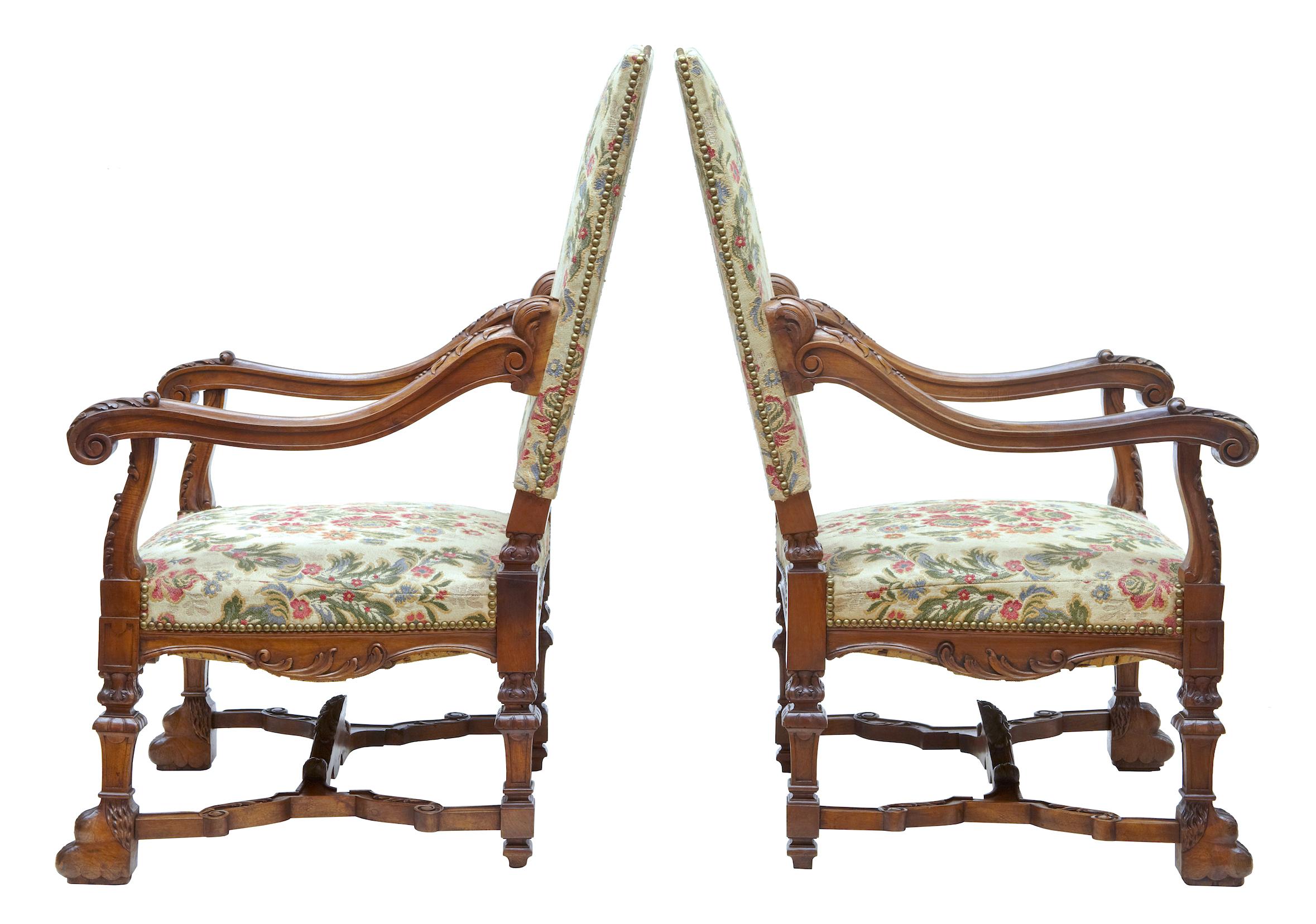 Superb pair of 19th century carved walnut French armchairs, circa 1870.

Finest quality pair of large French armchairs, circa 1870. Profusely carved with shells, florals and swags shaped arms which terminate in a scroll. Carved paw feet united by