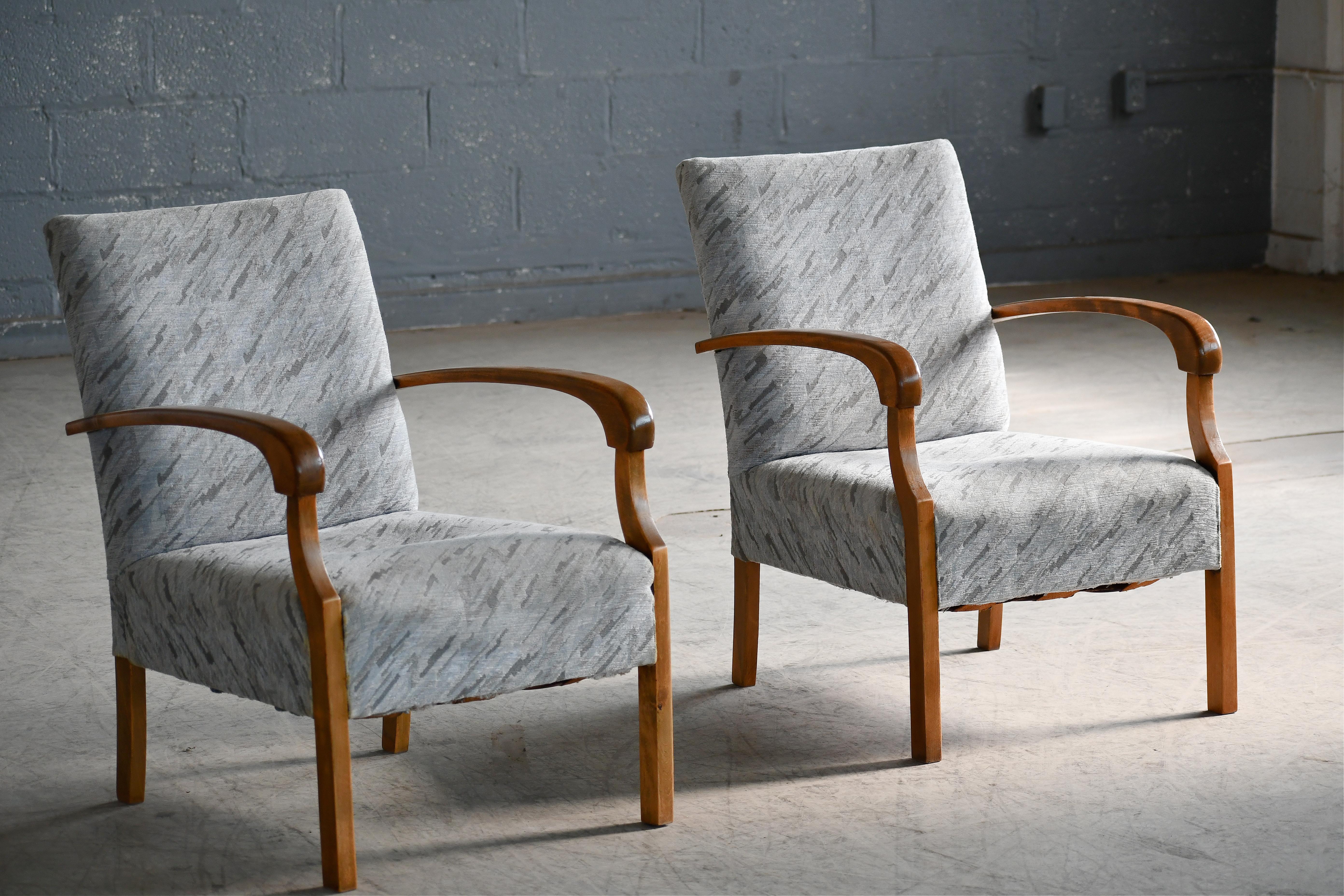 Superb Danish late Art Deco early midcentury chairs from the early 1930-40s with spring cushions and beautiful open armrests and legs carved in solid Birch with great grain and patina. We just love the simple yet very refined elegant design of these