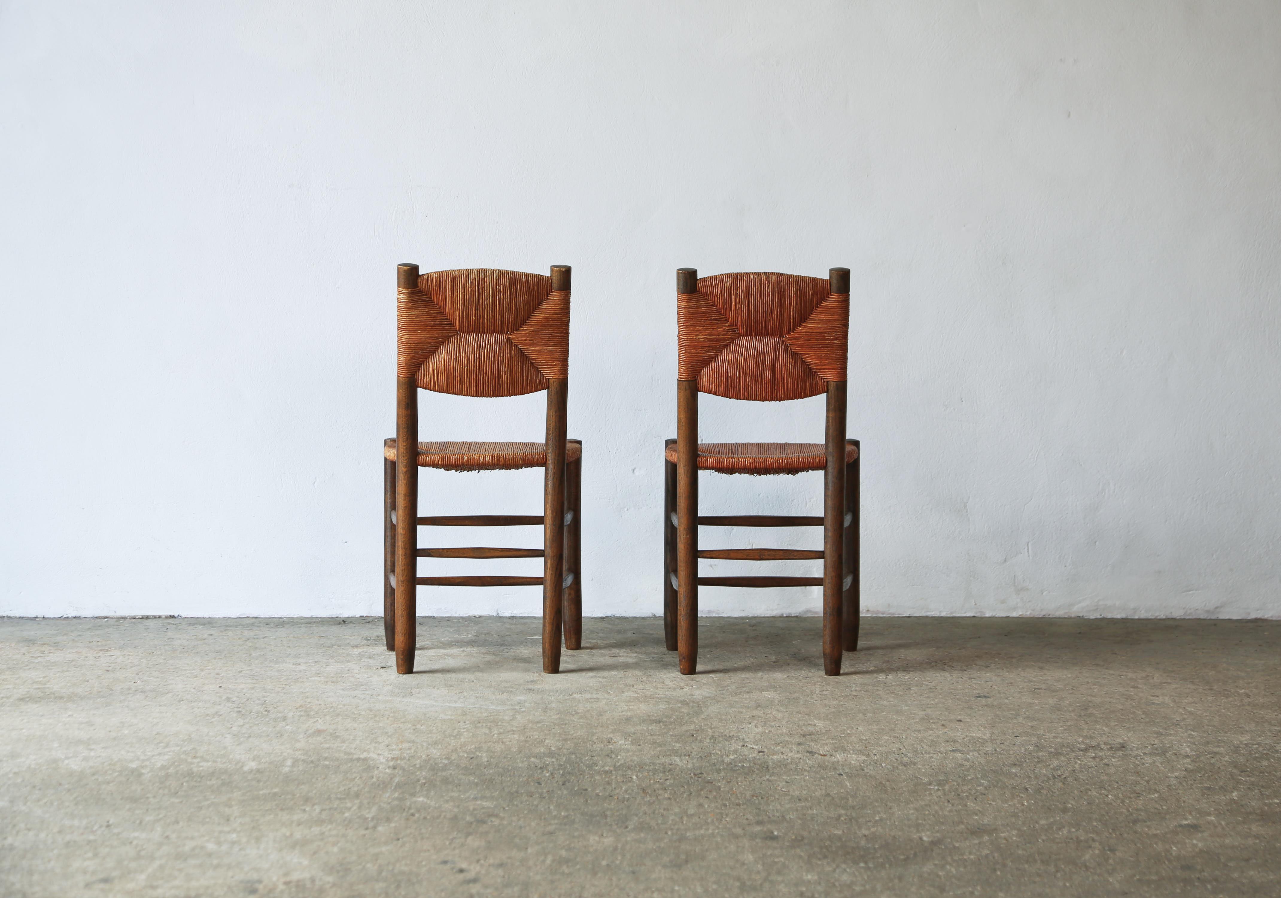 Jonc Superbe paire de chaises Charlotte Perriand modèle 19 Bauche, France, années 1950 en vente