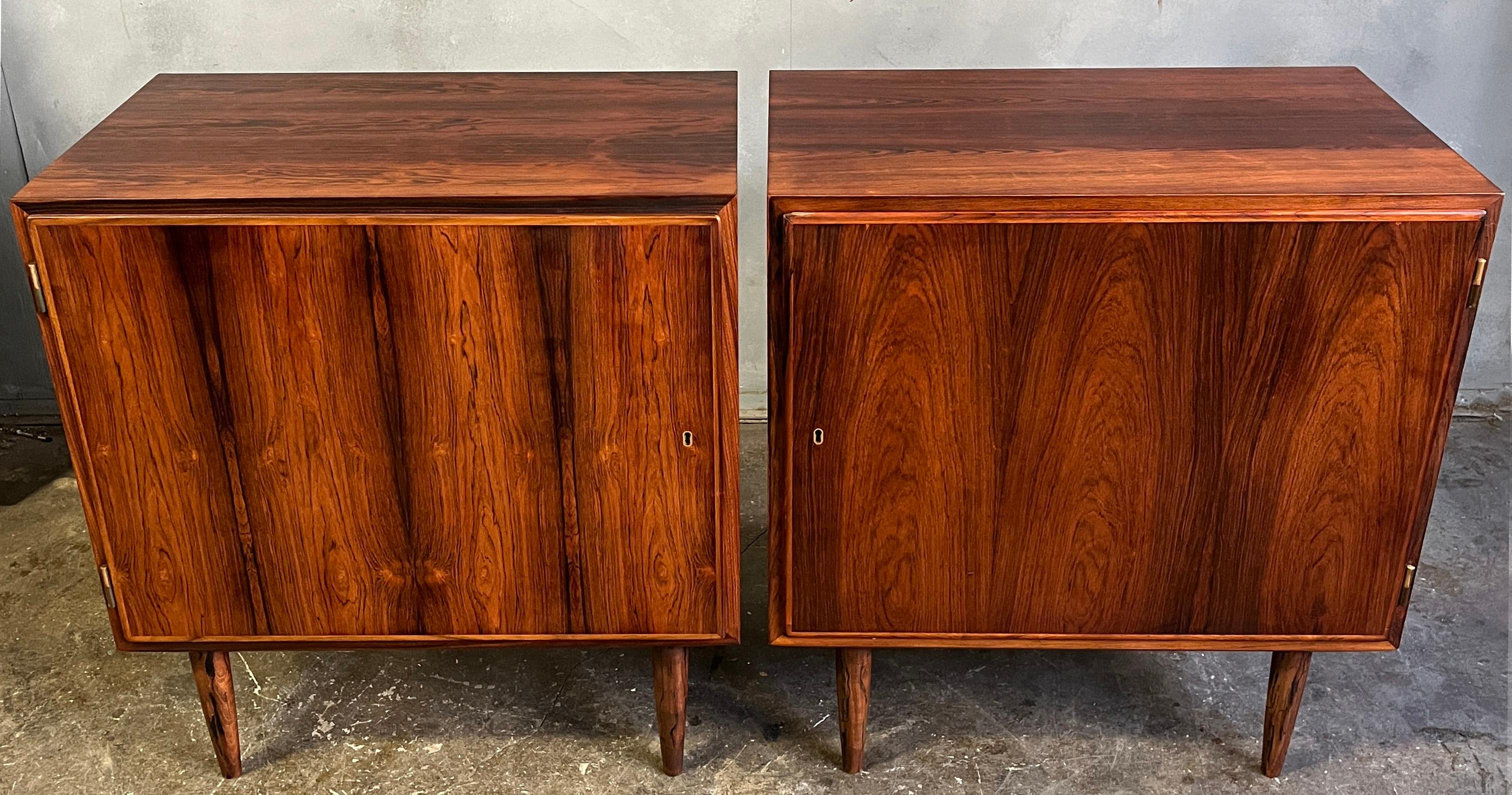 Midcentury modern small sideboards designed by Carlo Jensen and made by Hundevad & Co. These small cabinets have a beautiful figured grain highlighted by brass hardware. perfect for nightstands or storing your vinyl LP's.  Rarely seen in this size.