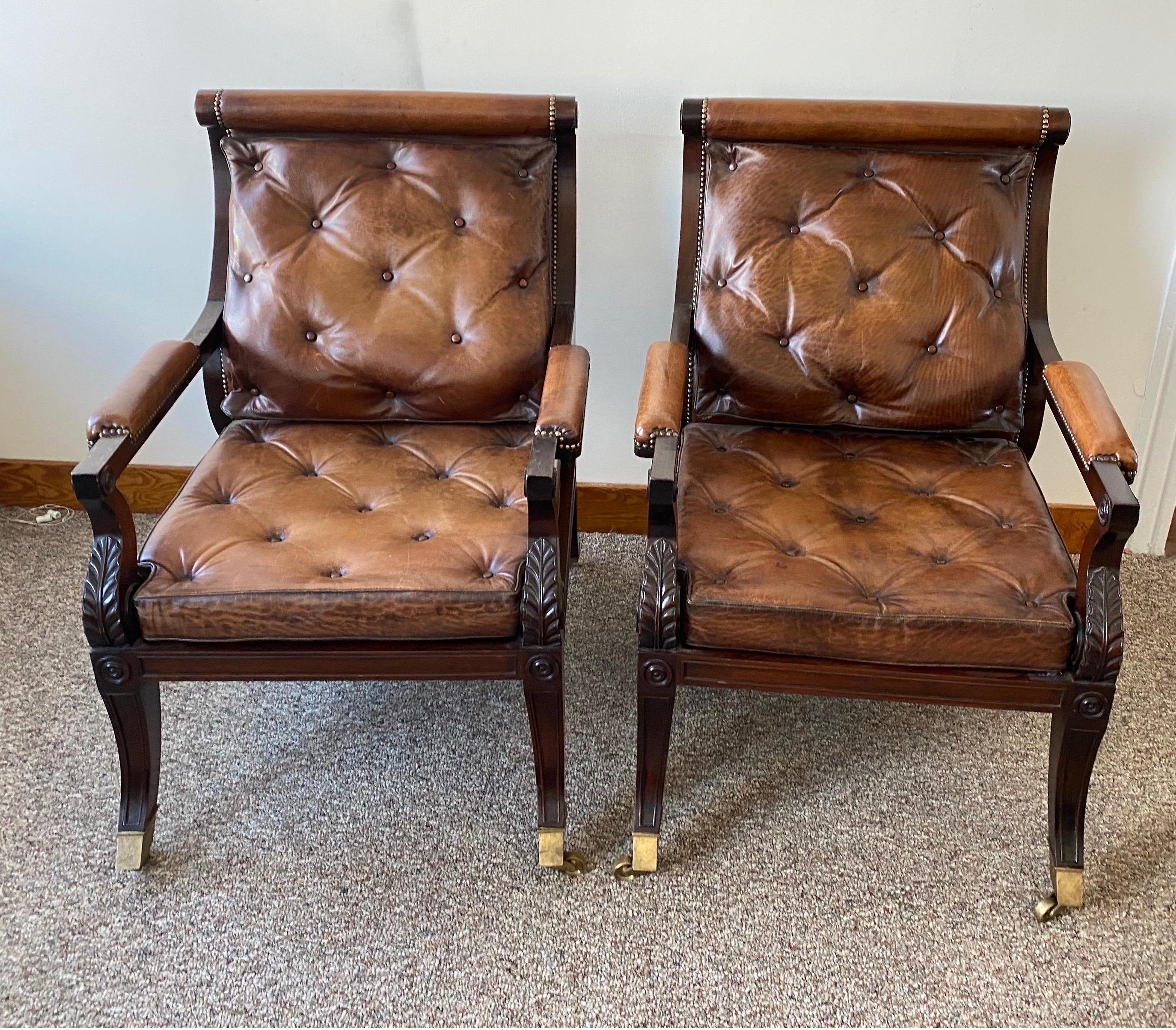 Superb pair of Regency style mahogany and leather library chairs, after Gillows. English. Nice, deep comfortable seats. Great castors. Perfectly worn leather.
