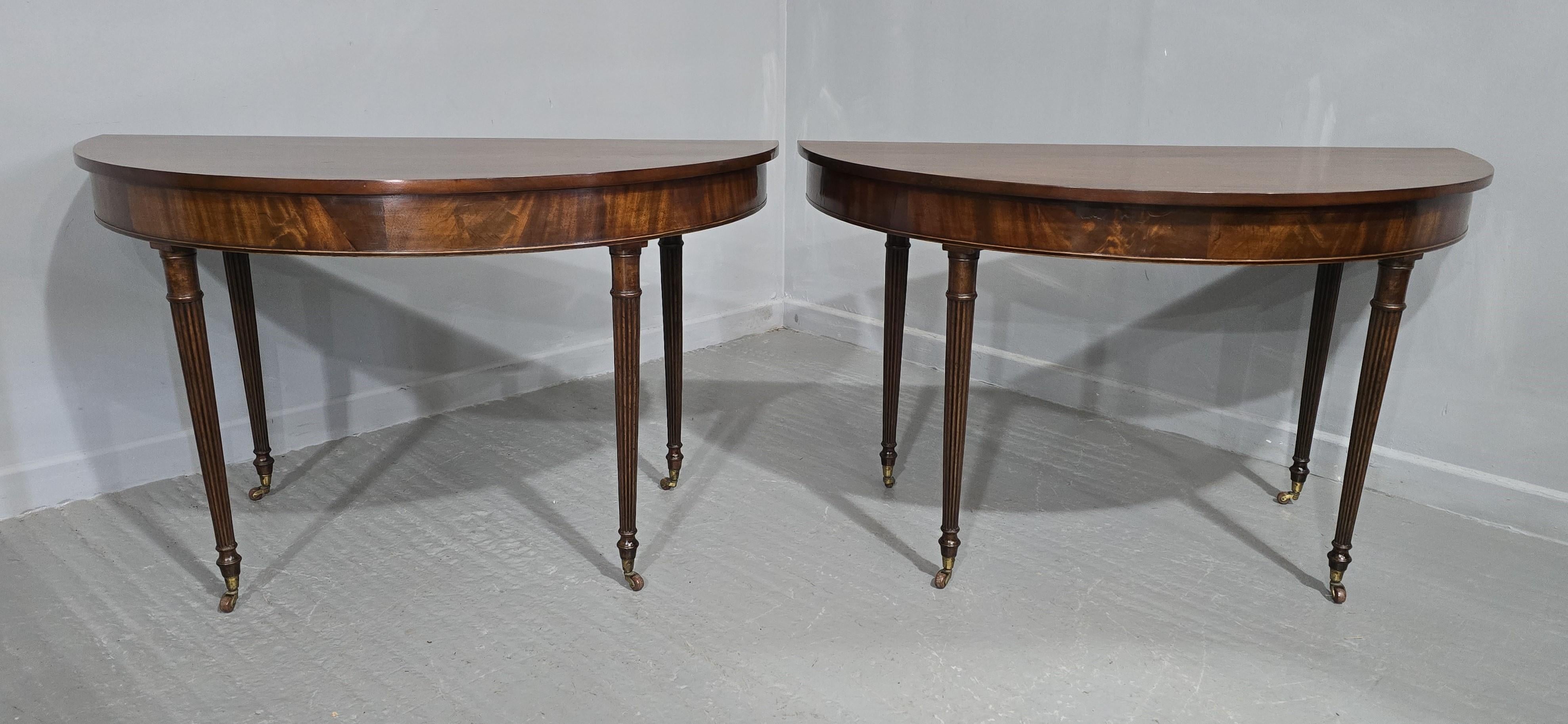 Very good pair of Regency mahogany console tables, solid tops, reeded legs terminating in original brass and pot cup castors, excellent colour and condition.

29