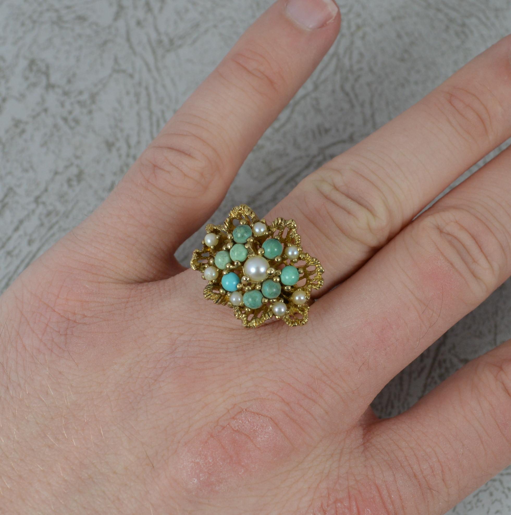 A superb vintage or retro cluster ring.
Solid 9 carat yellow gold example.
Set with pearls and turquoise stones throughout. 
23mm x 19mm cluster head. Protruding 10mm off the finger.

Condition ; Very good. Clean band. Well set stones. Issue