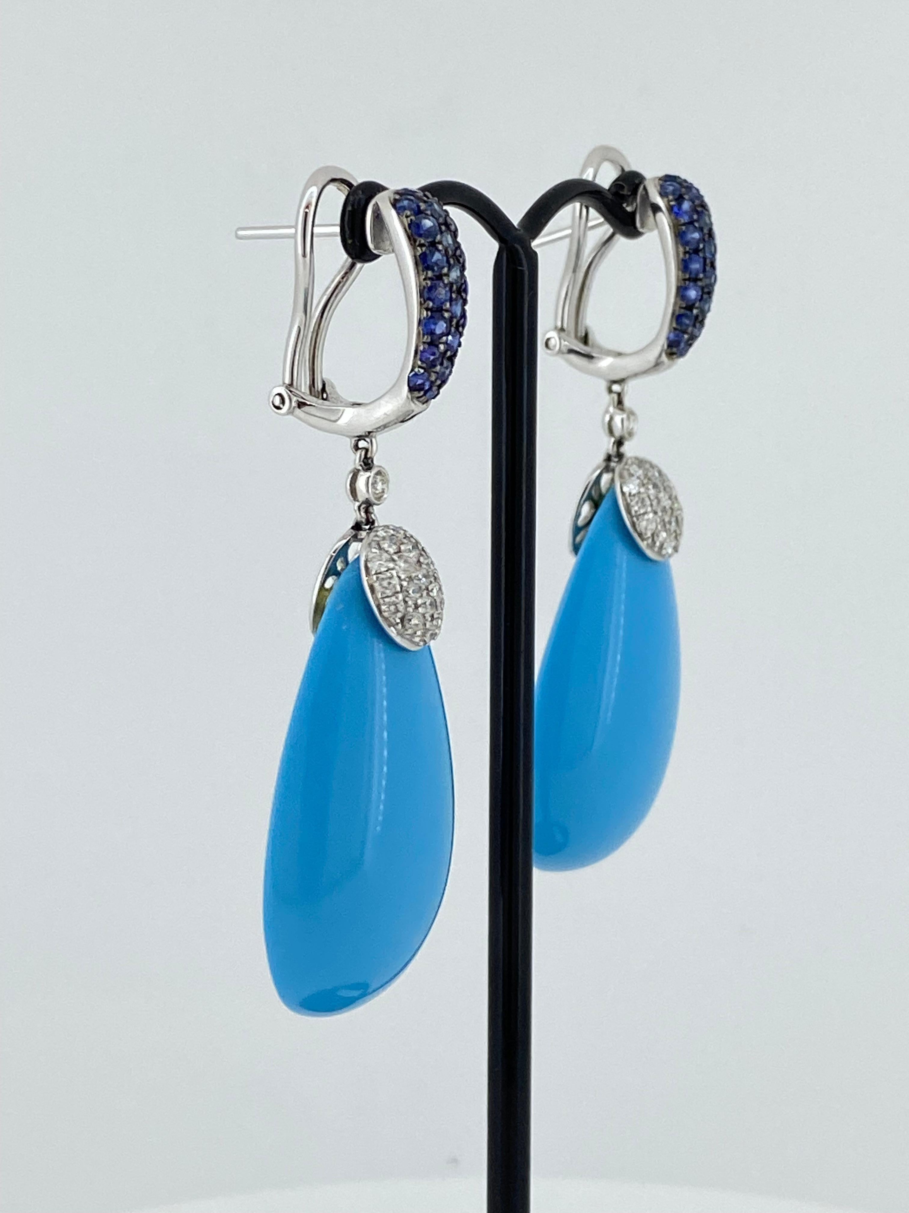 This magnificent pair of Natural Turquoise, 
Sapphire & Diamond Drop (Pendant) Earrings 
is handmade in Italy in 1970's

Meticulously crafted in 18K white gold, 
the pair features 2 pear cabochon cut Turquoise 
each of rarely seen & impressive