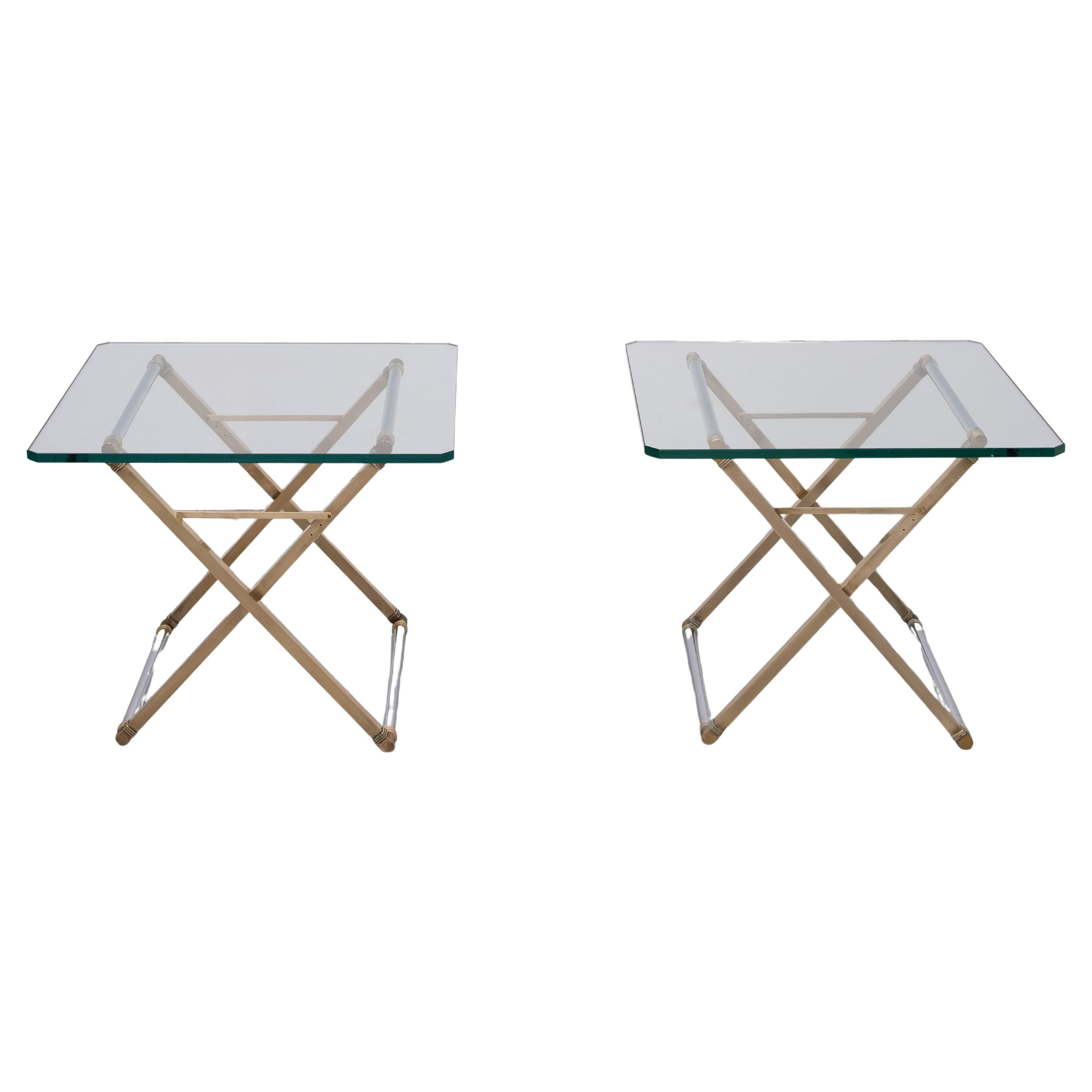 Beautiful highly decorative side tables designed and manufactured by Peter Ghyczy, The Netherlands 1970. These Hollywood Regency style side tables is made of chromed bars connected with brass cross legs. The base supports a 18 mm thick glass top and