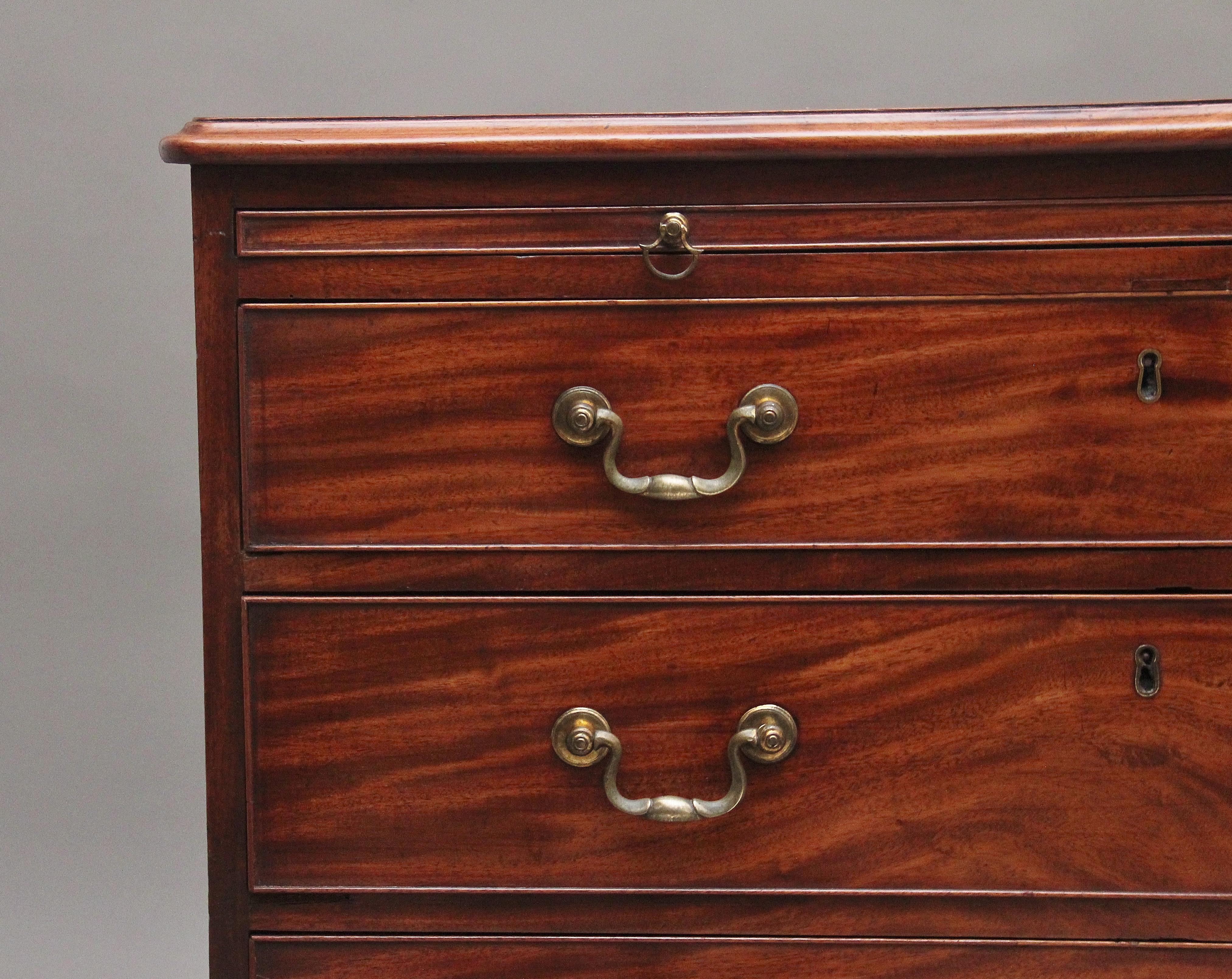 A superb quality 18th Century mahogany chest of drawers, having a nice figured top with a moulded edge above a brushing slide, four oak lined graduated drawers below with the original brass swan neck handles, lovely figuration on the drawer fronts