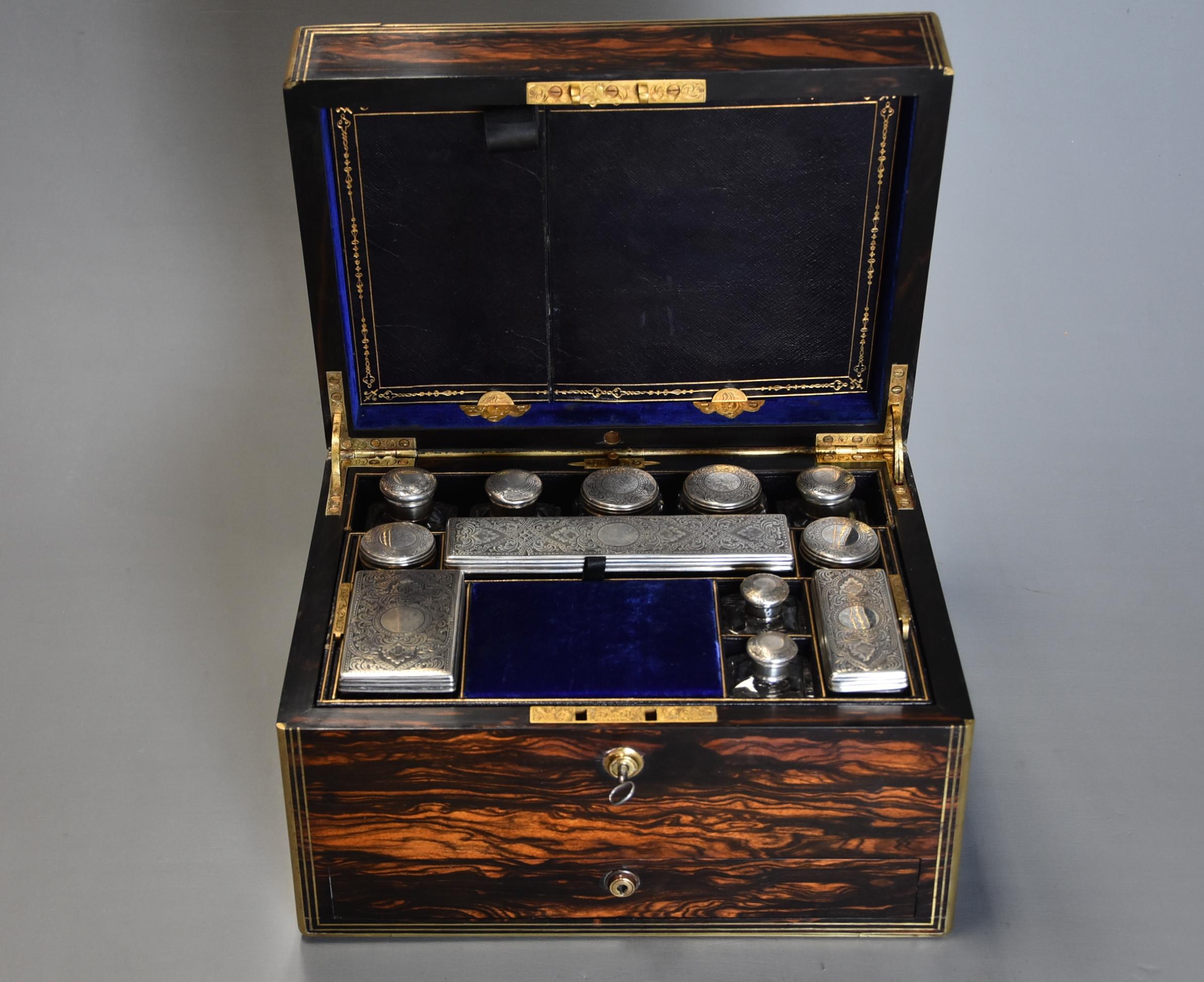 A superb quality late 19th century Coromandel and brass bound travelling vanity box.

The box consists of a beautiful Coromandel wood case with polished brass edge and brass stringing with chased brass cartouche.

The box opens to reveal