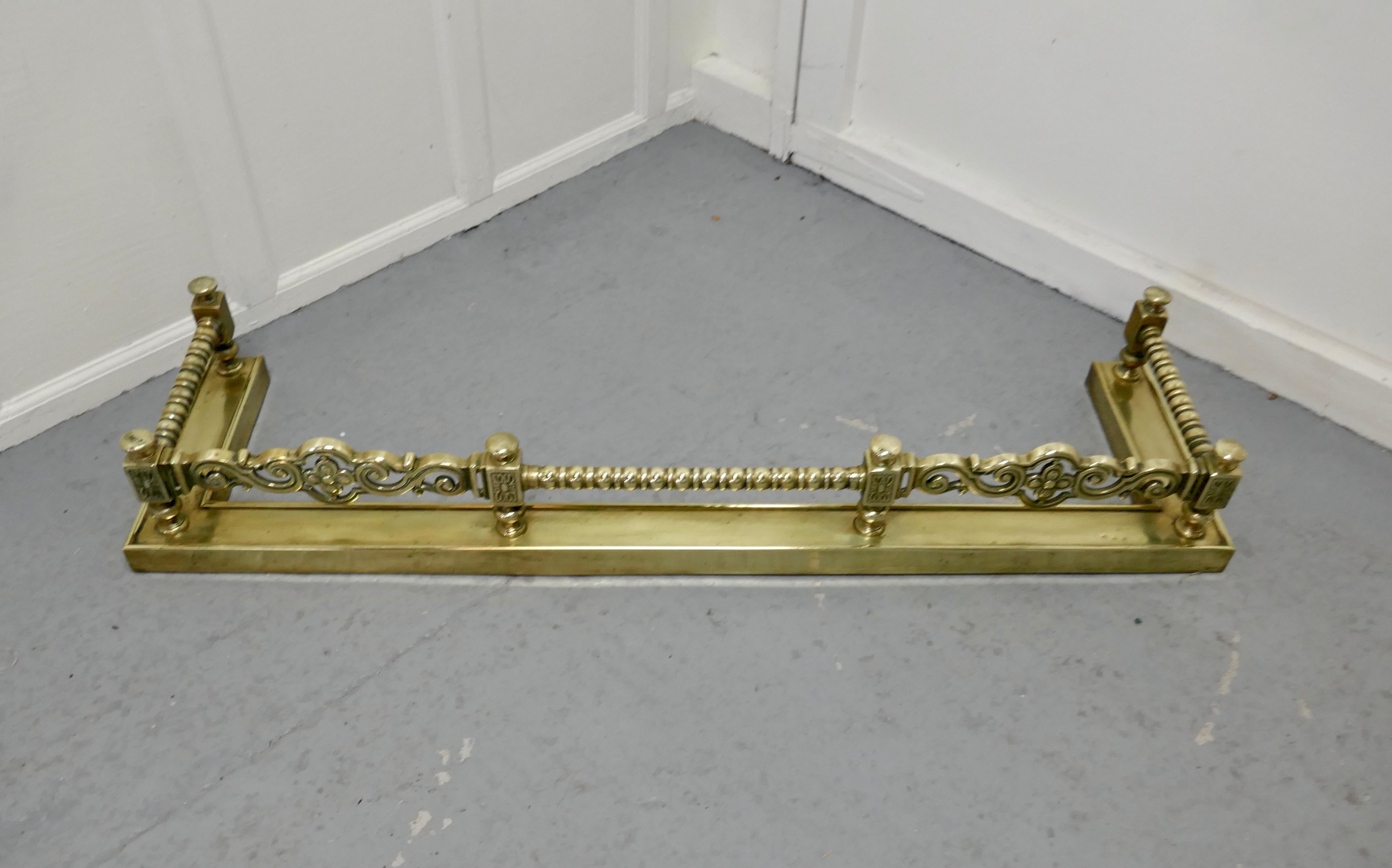 Superb quality and design 19th Century heavy brass fender

This is a superb quality brass fender it has a deep base and chunky twist spindles, this is one of the heaviest and finest quality fenders 
The Fender has delightfully crafted decoration