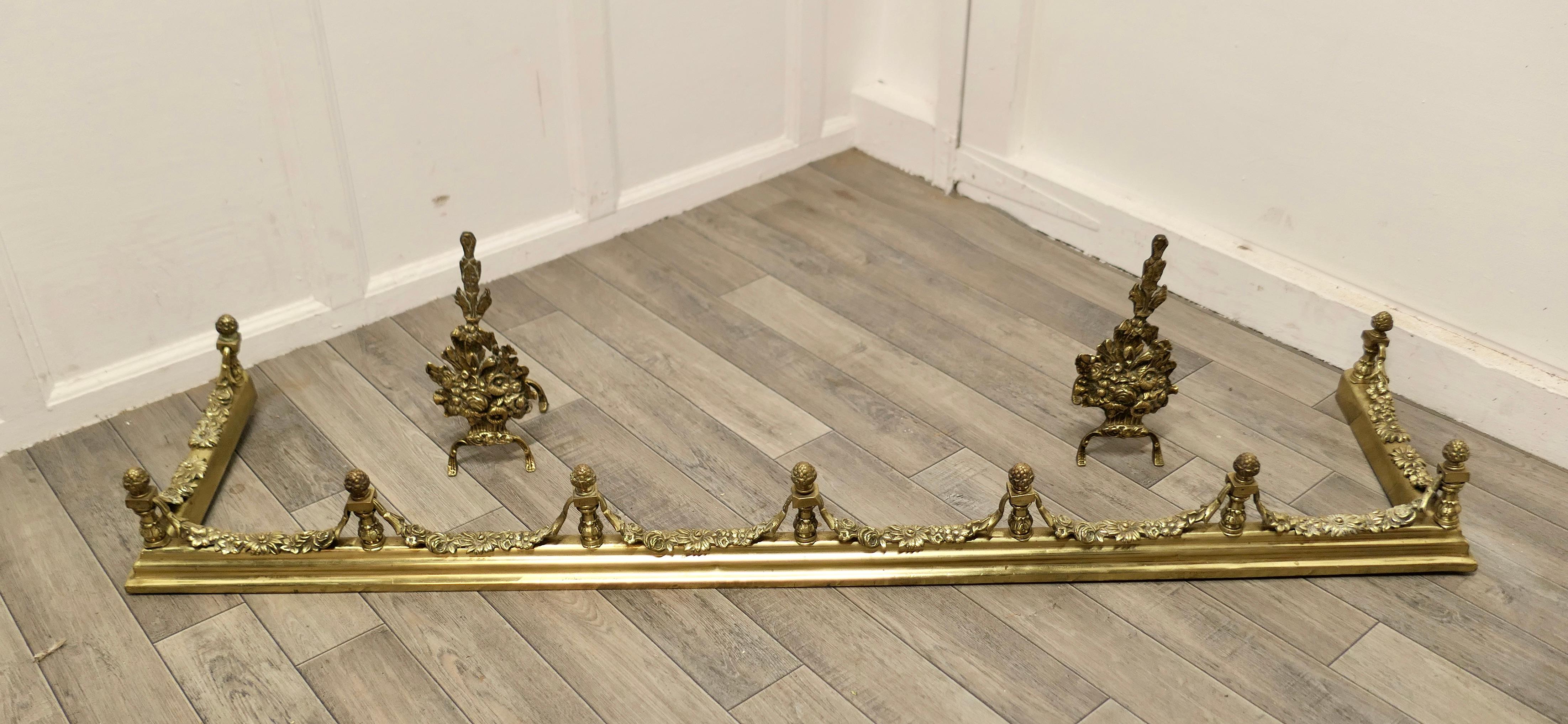 Superb quality and design 19th century heavy brass fender with andirons

This is a superb quality Set it has elaborate spindles and garlands of leafy swags matching the floral decoration on the andirons, this is one of the heaviest quality and