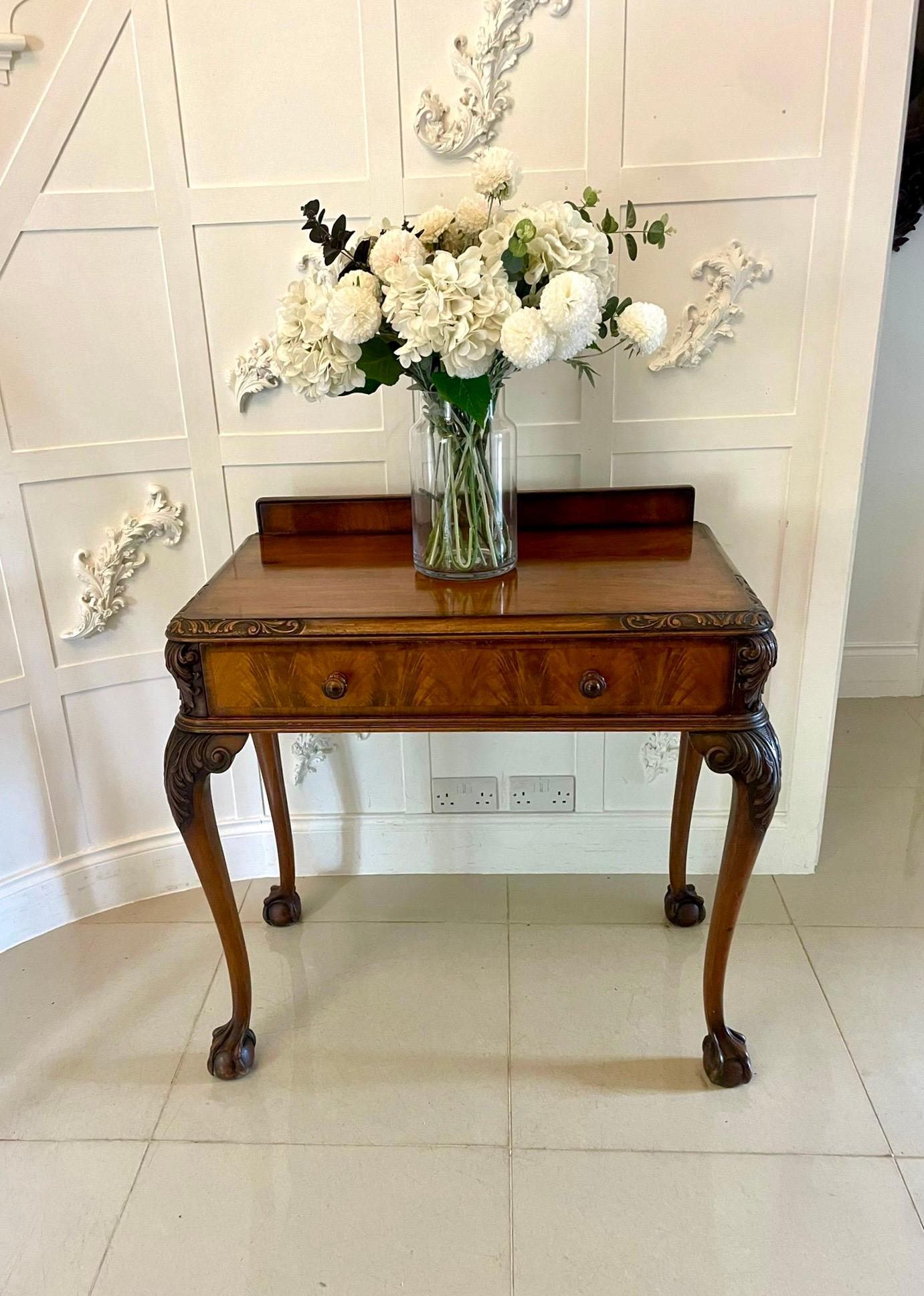 Superb quality antique carved burr walnut hall/console table by Maple and Co.having a low burr walnut back, burr walnut top with a moulded and quality carved edge above one long drawer with original carved walnut knob handles standing on shaped