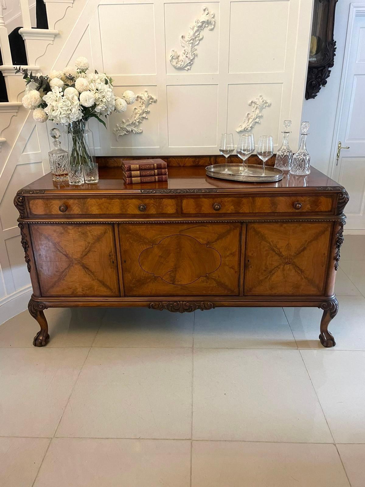 Superb quality antique carved burr walnut sideboard by Maple & Co. having a low burr walnut back, burr walnut top with a moulded and quality carved walnut edge above two long drawers with original carved walnut knob handles above three doors opening