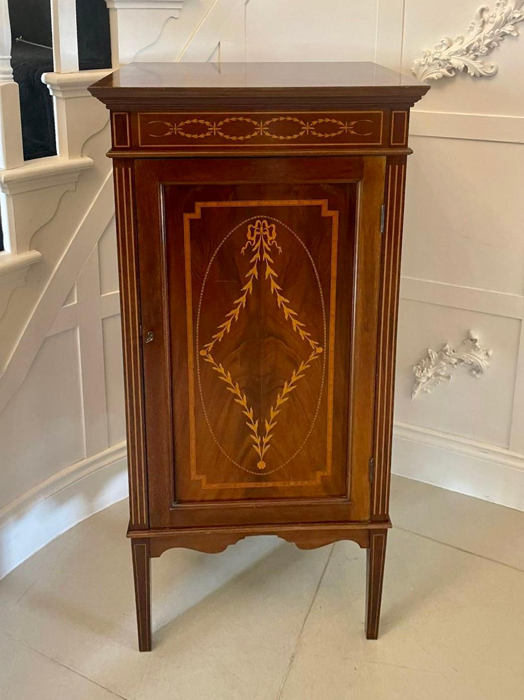 Superb quality antique Edwardian mahogany inlaid side cabinet having a quality mahogany top crossbanded in satinwood, mahogany inlaid frieze,  one single panelled door inlaid with satinwood opening to reveal four shelves, mahogany sides with