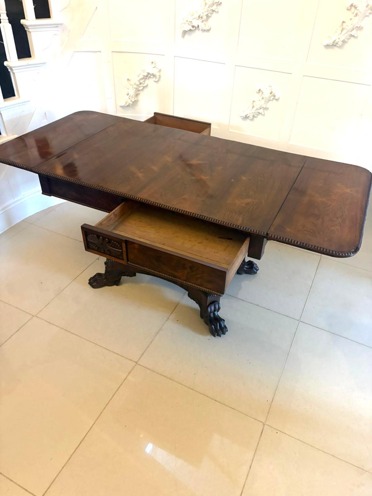 Superb quality antique Regency Freestanding sofa table having a superb quality rosewood top with two drop leaves, the rectangular top is bordered with a finely carved gadroon edge with two drawers and two dummy drawers to the frieze.  The central
