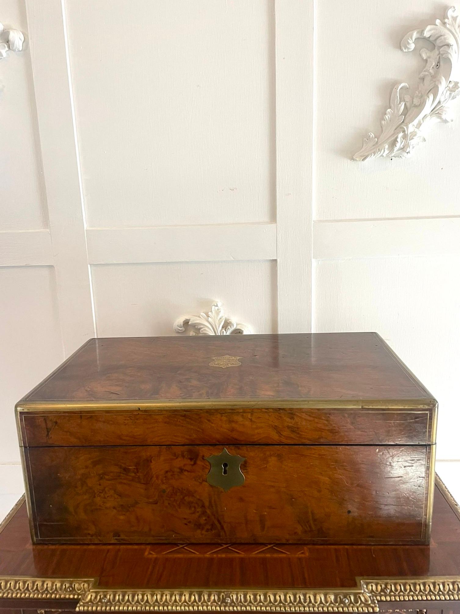 Superb quality antique Victorian burr walnut brass bound writing box having brass bounded corners and edges around a superior quality burr walnut writing box opening to reveal a writing surface inkwells, pen tray and two lift up lids opening to