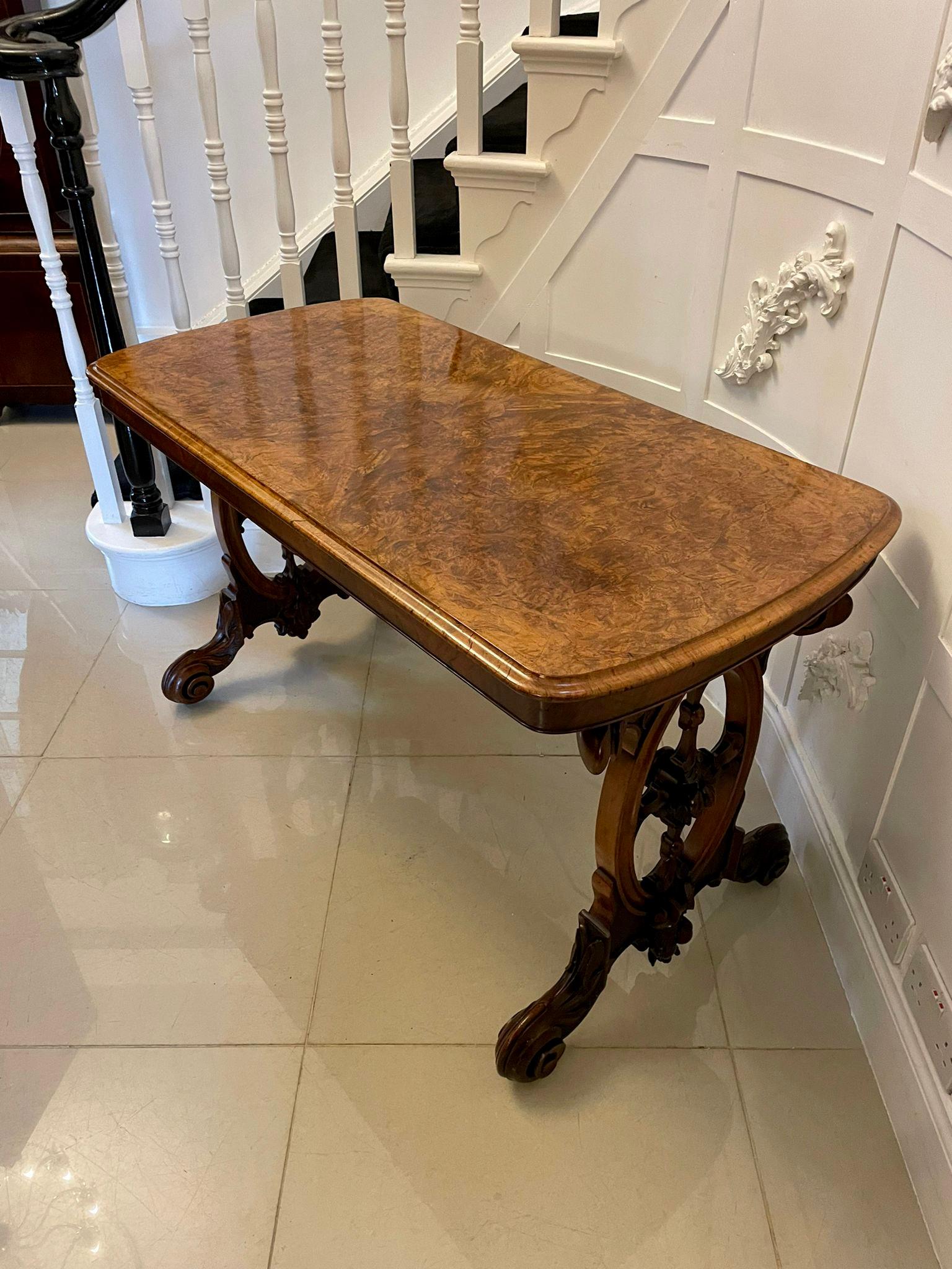 Superb quality antique Victorian burr walnut centre table having a superb quality burr walnut top with a moulded edge supported by outstanding carved solid walnut ends with beautifully carved fruit, flowers, leaves and scrolls standing on shaped